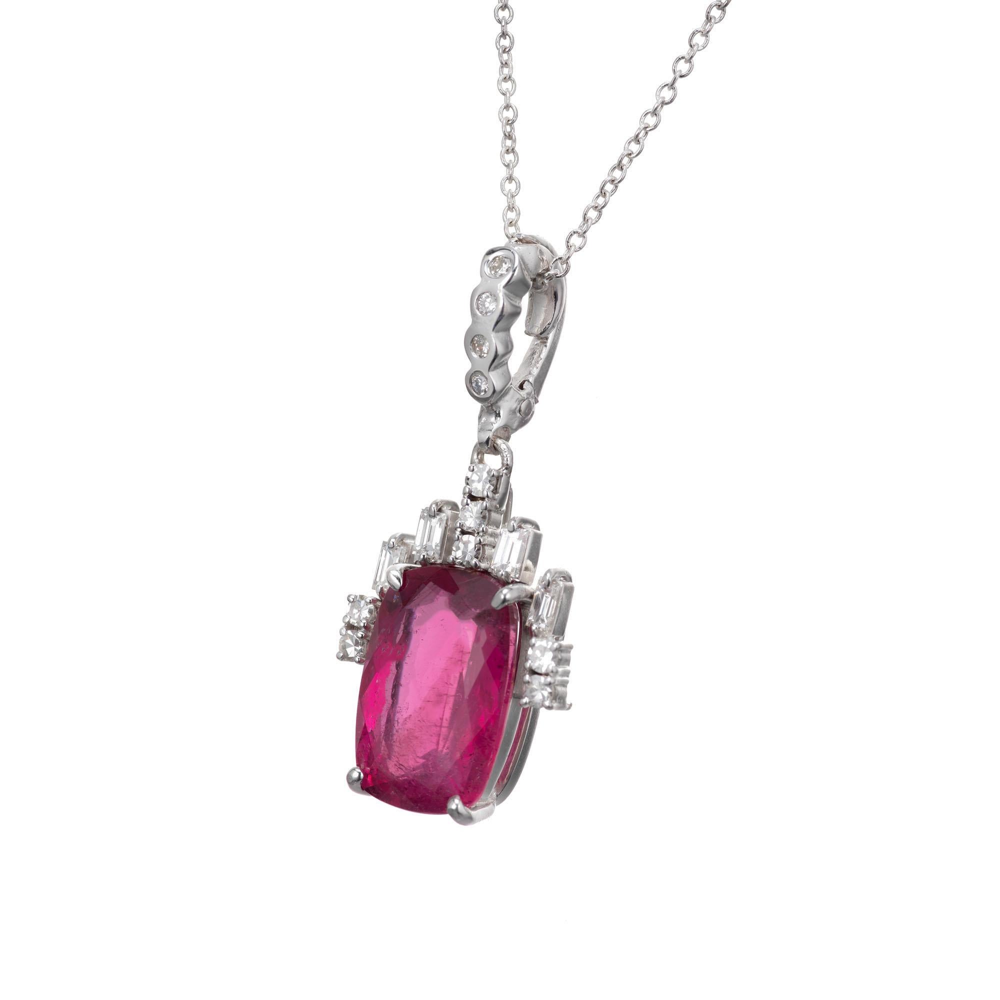 Vintage 1960’s pink tourmaline and diamond pendant necklace. Bright pink tourmaline accented with baguette and round diamonds set in 18k white gold setting with an 18k white gold chain. 

1 cushion rectangular cut pink tourmaline MI, approx. 4.75cts