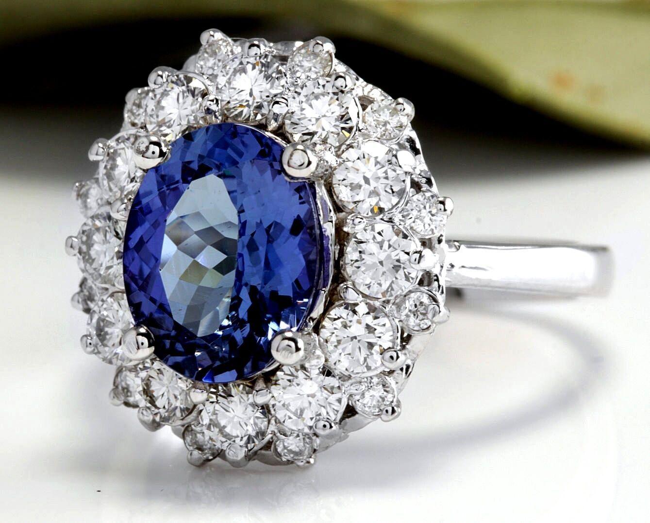 4.75 Carats Natural Very Nice Looking Tanzanite and Diamond 14K Solid White Gold Ring

Total Natural Oval Cut Tanzanite Weight is: 3.50 Carats

Tanzanite Measures: 9.00 x 7.00mm

Natural Round Diamonds Weight: 1.25 Carats (color G-H / Clarity