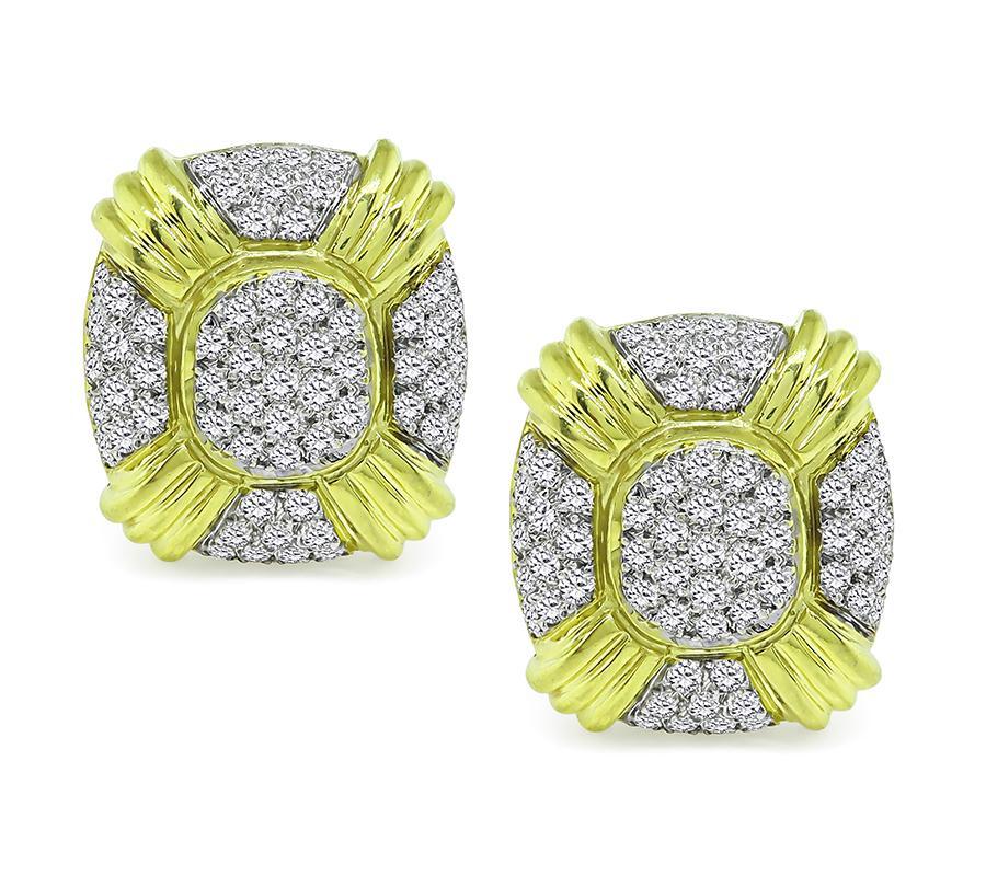 This is an elegant pair of 18k yellow and white gold earrings. The earrings feature sparkling round cut diamonds that weigh approximately 4.75ct. The color of these diamonds is G-H with VS2 clarity. The earrings measure 25.5mm by 23mm and weigh 24.1