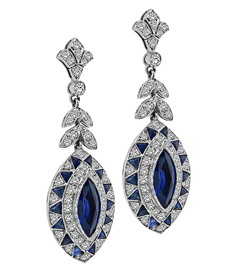 This is a charming pair of 18k white gold earrings. The earrings feature lovely marquise and trilliant cut sapphires that weigh approximately 4.75ct. The sapphires are accentuated by sparkling round cut diamonds that weigh approximately 1.70ct. The