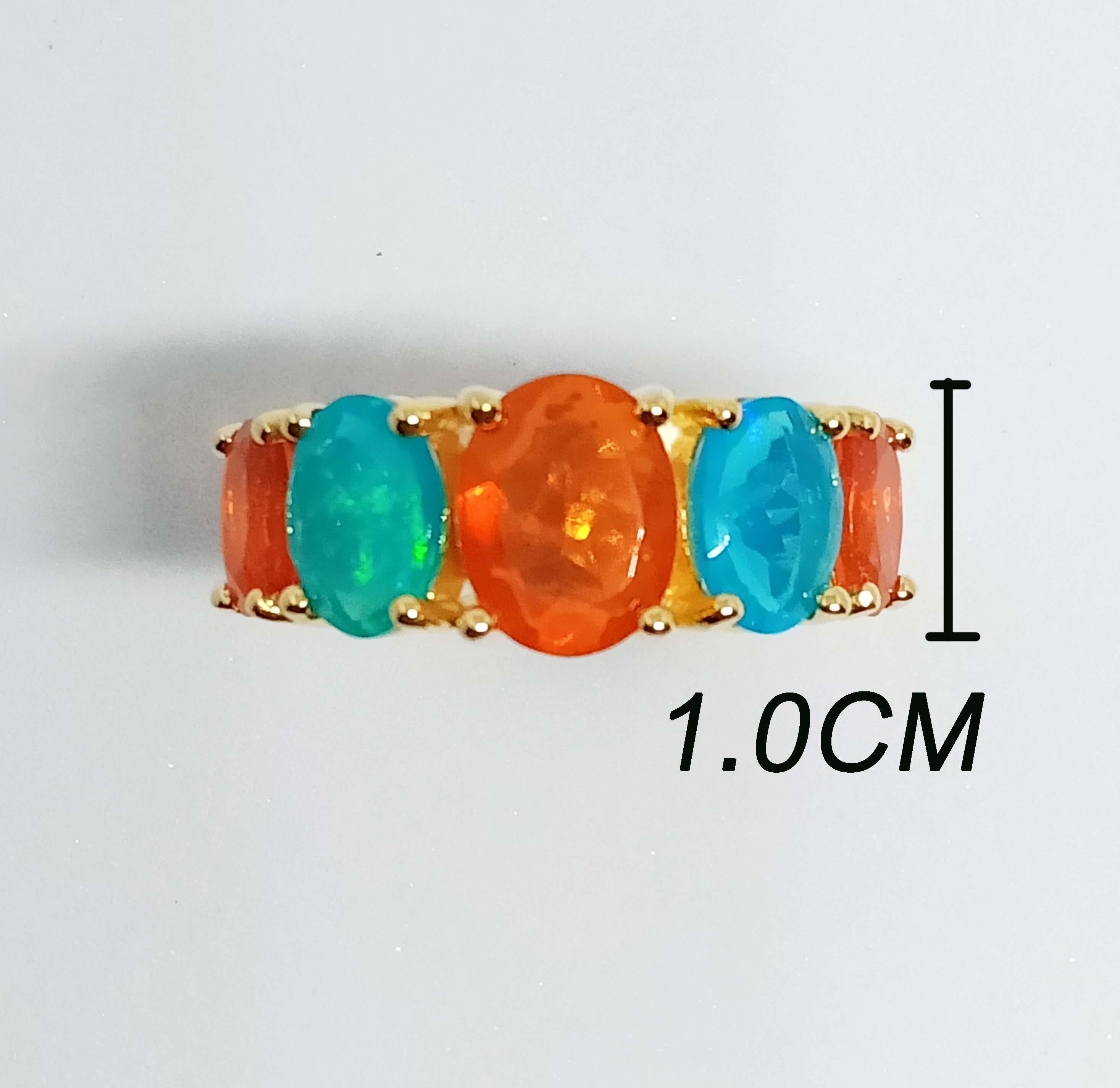 Orange Opal Oval  9x7 mm. 1 pc.
Blue Opal Oval 8x6  mm. 2 pc.
Orange Opal Oval  7x5 mm. 2 pcs. 
All Total 4.75 cts.
Sterling Silver in 18K Gold Plated.
Size ring 7 us.


