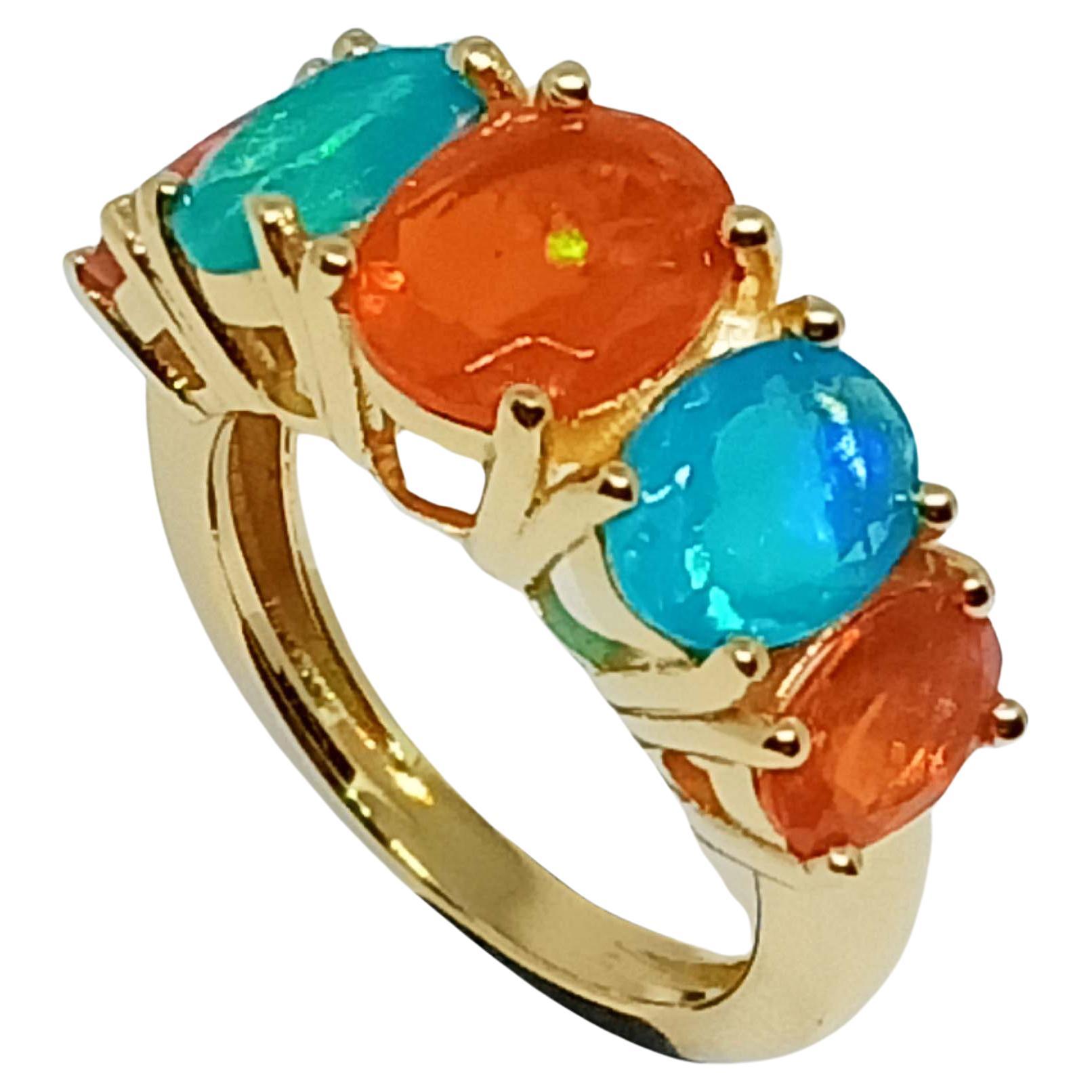 4.75cts. Orange and Blue Opal Ring.Sterling Silver in 18K Gold Plated.