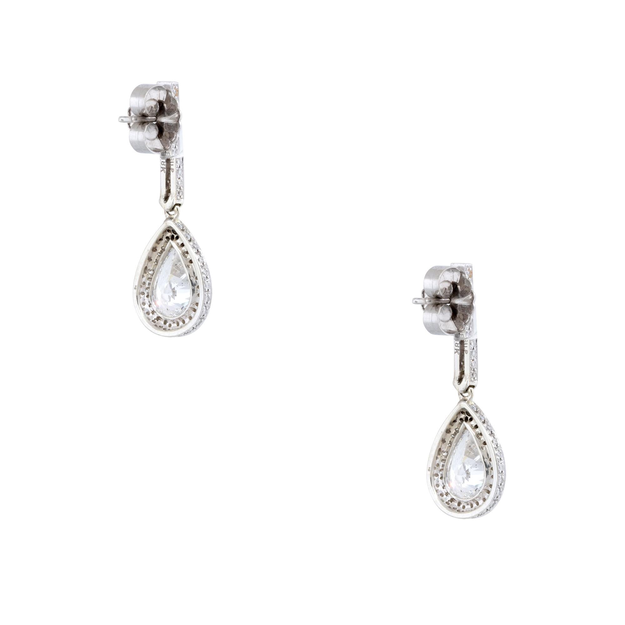 GIA/EGL Graded Natural Pear Shape Diamond Halo 18 Karat Drop Earrings

This pair of earrings are stunning with 1 natural, pear-shaped diamond, set in each earring. The stones are 2 carats each, SI2 in clarity, and near-colorless to colorless in