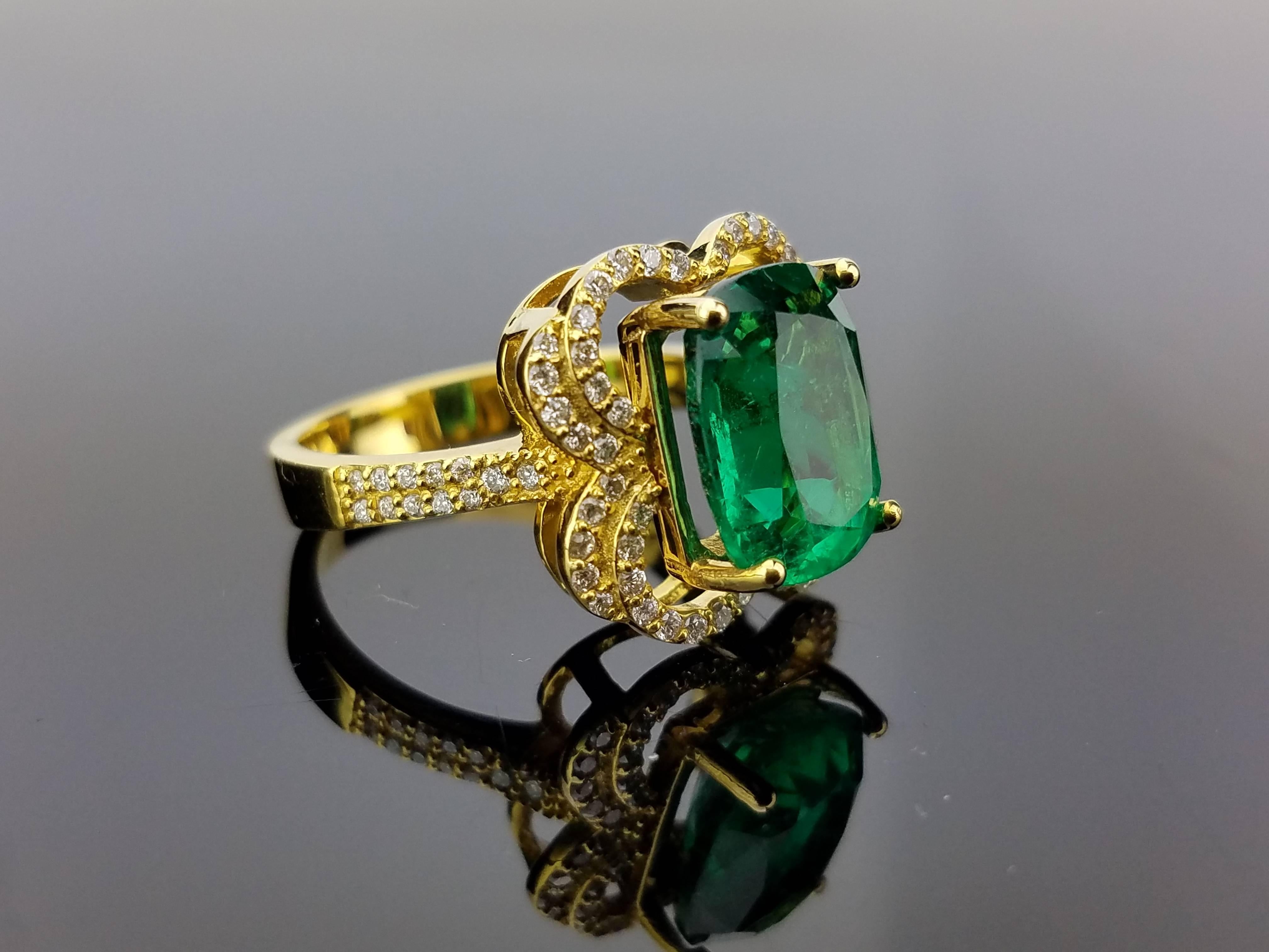 A unique combination of  Zambian Emerald of great quality (clean and lustrous) and diamond set on 18K yellow gold - creating this beautiful cocktail ring

Stone Details: 
Stone: Emerald
Carat Weight: 4.77 Carats

Diamond Details: 
Total Carat
