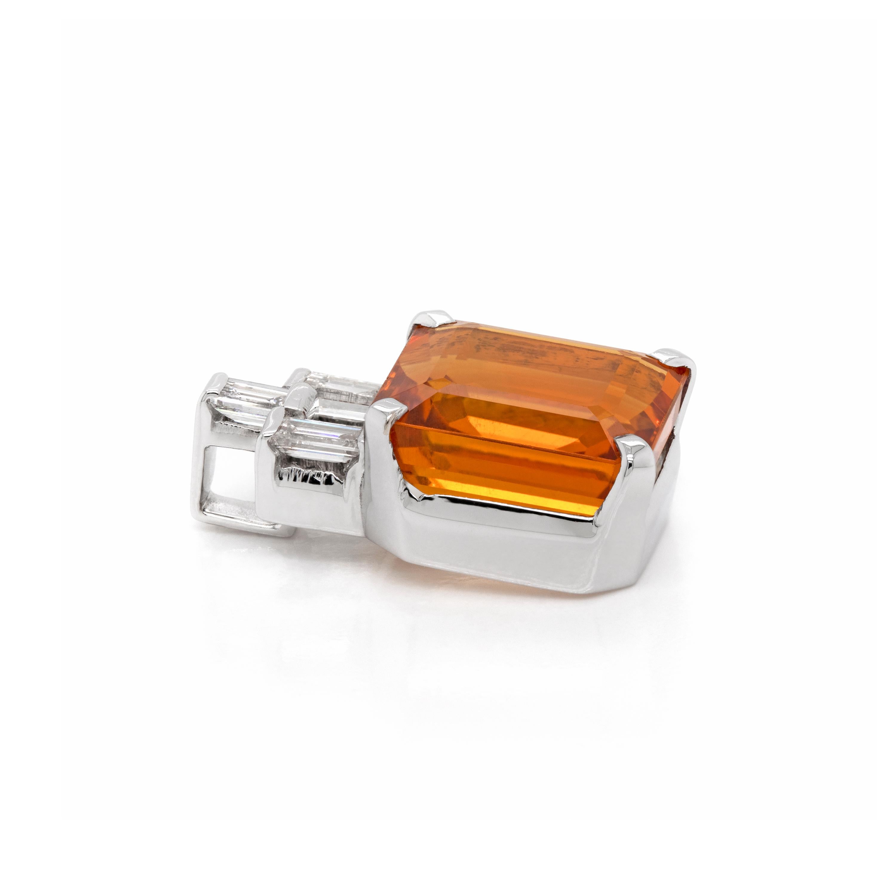 This wonderful geometric pendant features a rich square step cut citrine weighing 4.77ct mounted in a four claw, open back setting, The vibrant gemstone is accented above by a trio of baguette cut diamonds, weighing a combined 0,25ct, all rubover