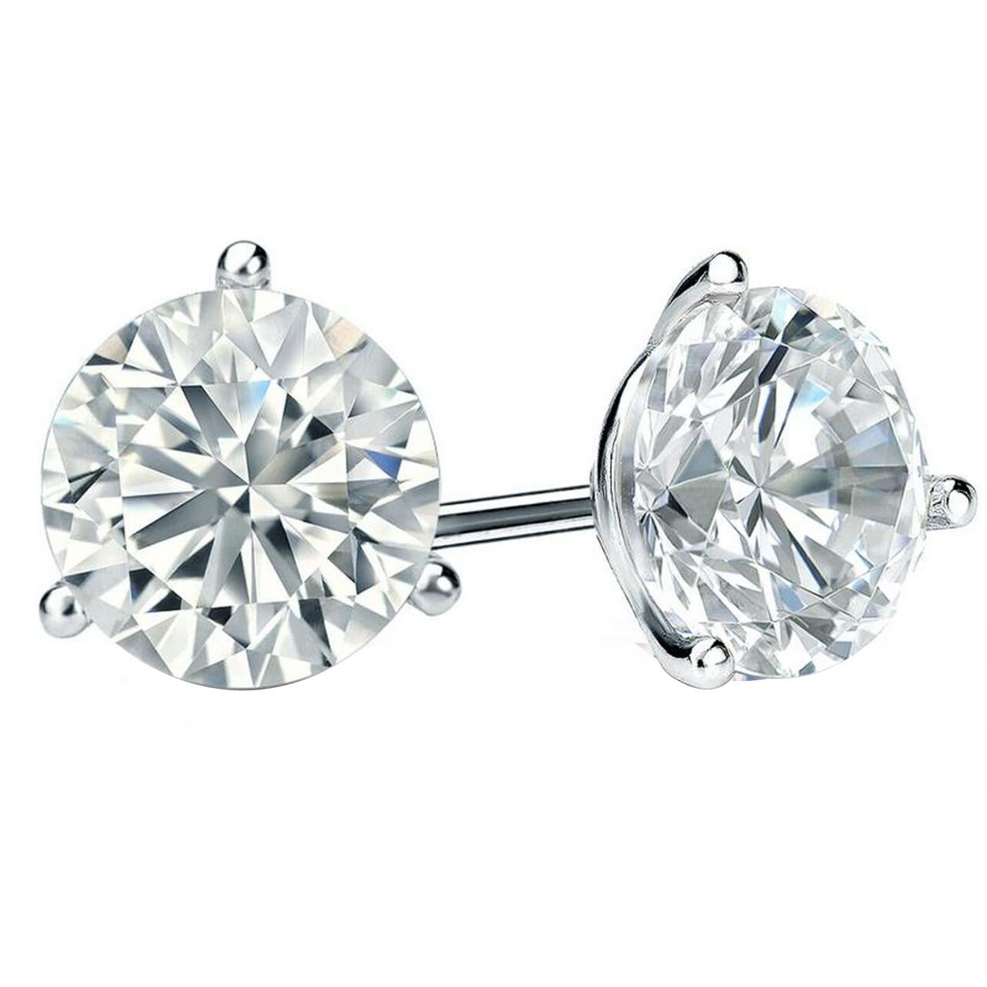 This Carat pair of round brilliant cut natural diamonds are impressive in size. Very well cut, dazzlingly brilliant, and eye clean in the ear! both are exceptionally well cut, They are very brilliant, Perfect for studs! Bright White, They are graded