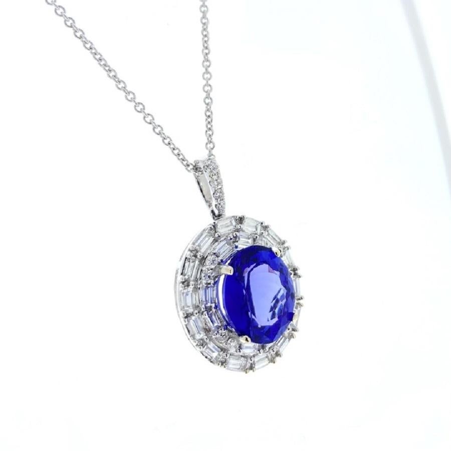 This pendant is a breathtaking display of elegance and sophistication. Crafted in 18 karat white gold, it features a stunning 4.78 carat oval-shaped blue tanzanite as its centerpiece. The tanzanite's mesmerizing blue hue is captivating, evoking a