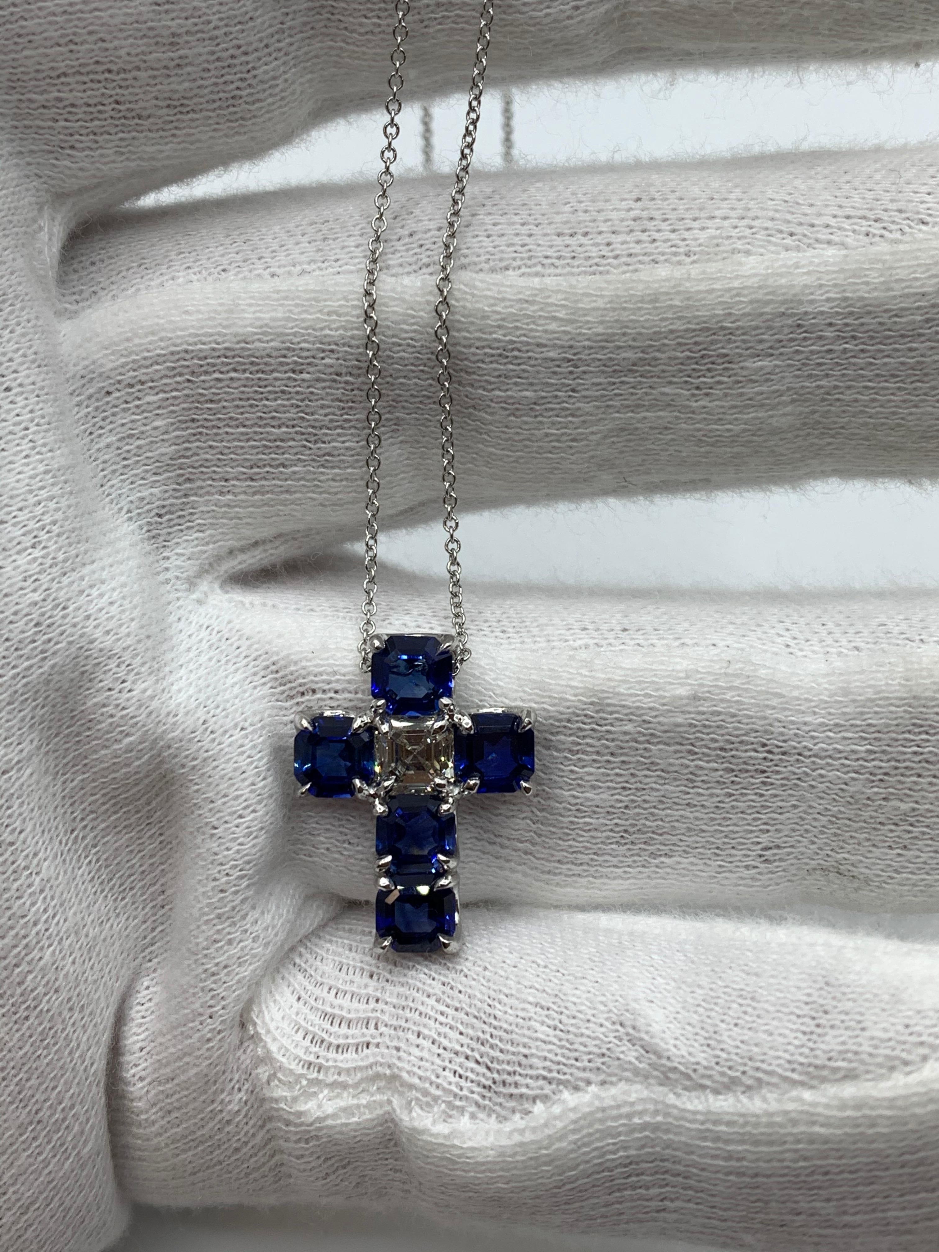 Asscher Cut Sapphires and White Asscher Cut Diamond set in this beautiful and minimalistic Cross. Set with very little metal to allow light to pass from all angles for maximum brilliance.
5 Sapphires weighing 4.03 Carat.
1 Diamond Weighing 0.75