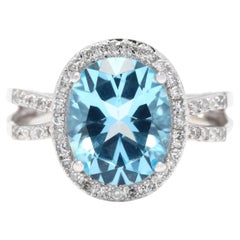 Bague à tige fendue en or blanc 14 carats, topaze bleue de 4,7 carats et halo de diamants, taille 6,5