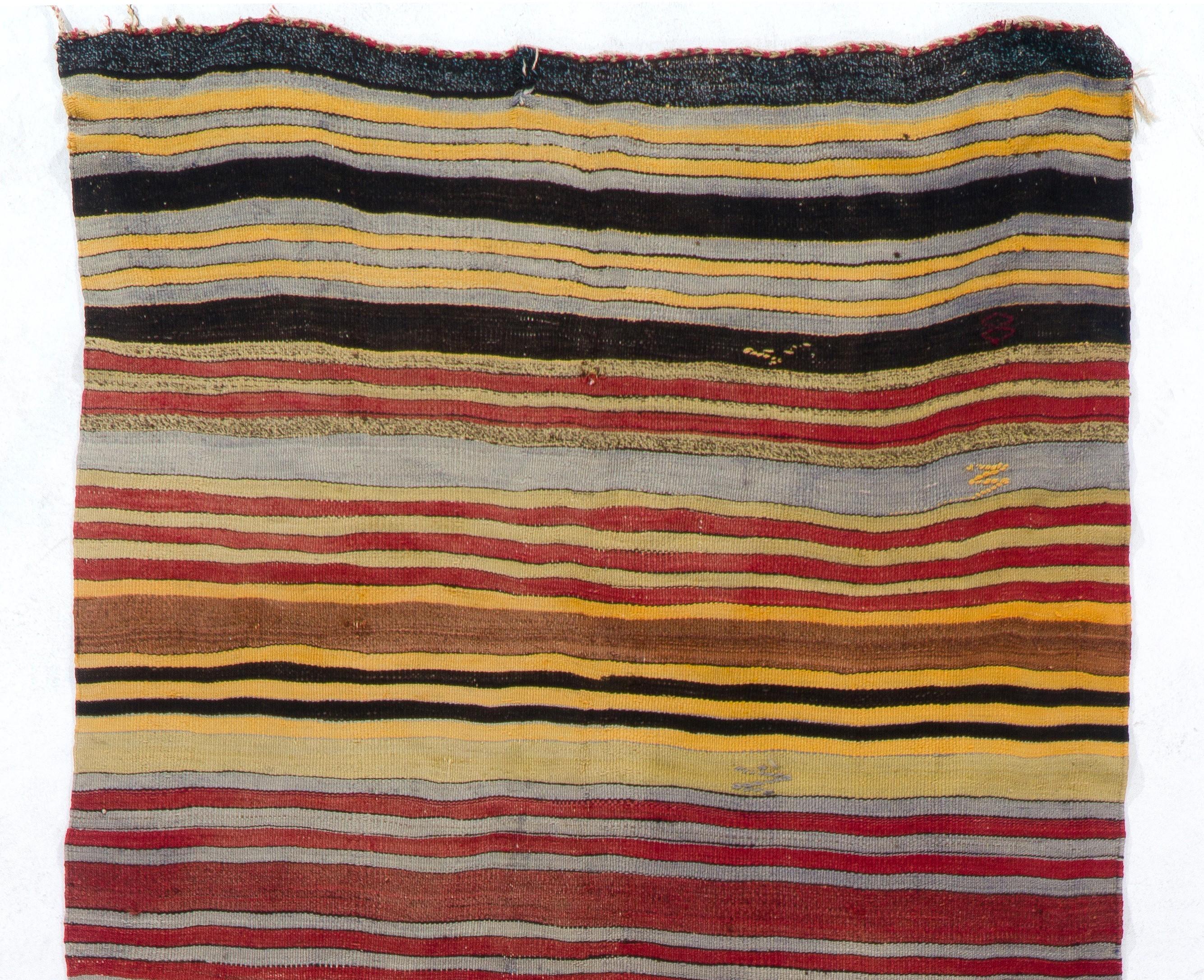 Vintage handwoven flat-weave (Kilim) with striped design, 100% wool. Measures: 4.7 x 11.2 Ft
We can modify the dimensions if requested, i.e. make it shorter and/or narrower.
Reversible; both sides can be used.
Ideal for both residential and