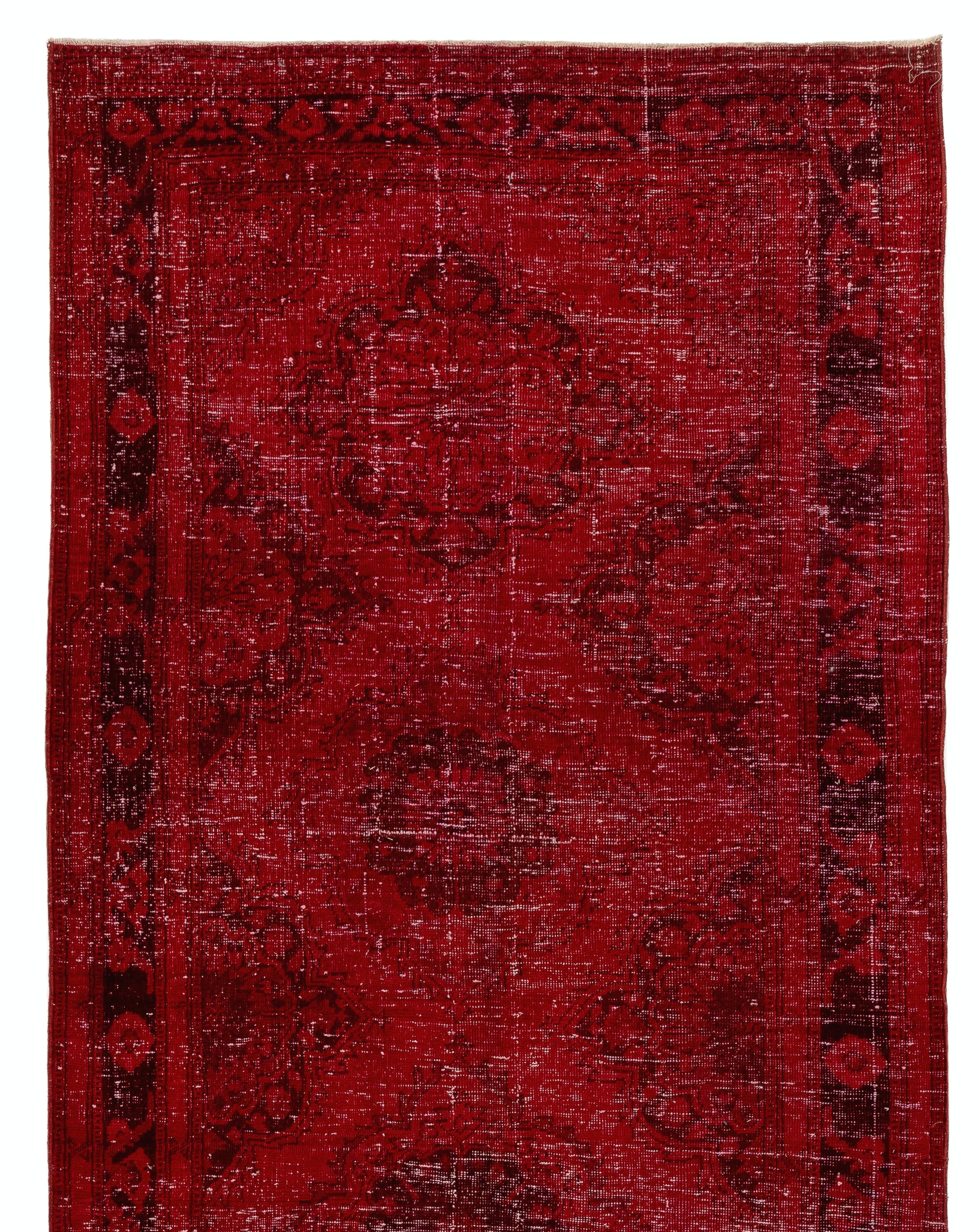 A vintage, hand-knotted and distressed Turkish runner rug made of wool, over-dyed in red color, featuring a design of linked medallions. Great for contemporary interiors. Size: 4.7 x 12.4 ft.

It is finely hand-knotted and has low wool pile on