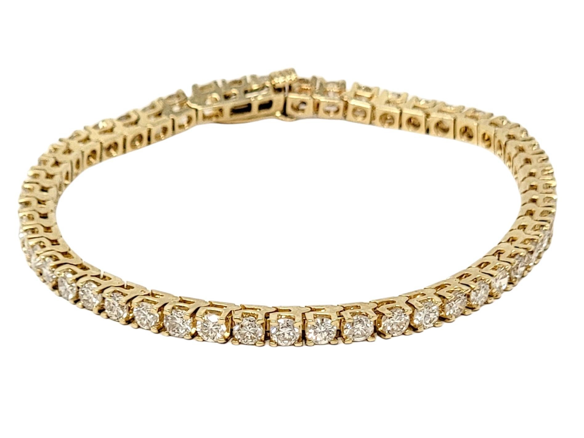Absolutely stunning diamond tennis bracelet that will stand the test of time. The elegant yellow gold setting paired with the timeless round diamonds makes this piece a true classic that will never go out of style.   
The 48 glittering prong set