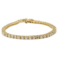 Bracciale tennis con diamanti tondi e brillanti da 4,8 carati totali in oro giallo 14 carati
