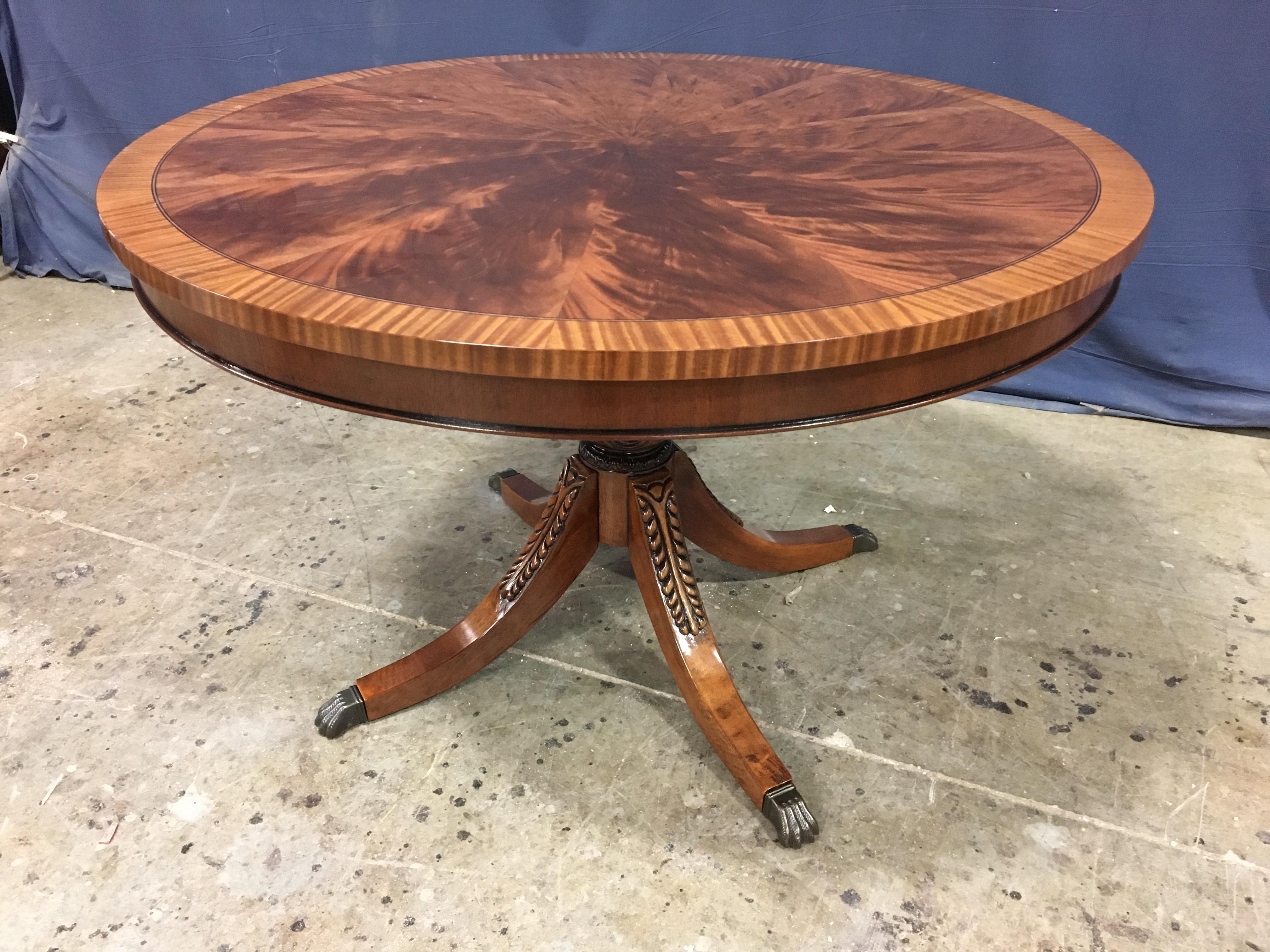 This is made to order round traditional mahogany foyer or dining table made in the Leighton Hall shop. It is ideal as a foyer table, breakfast table or dining table for an apartment or condo. It features field of radial cut West African swirly