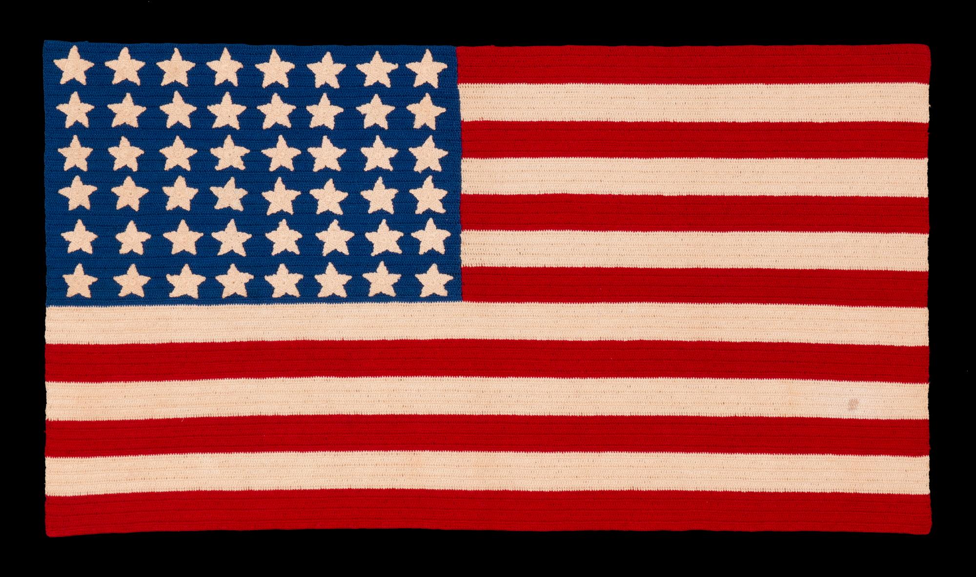 48 STARS ON A CROCHETED AMERICAN FLAG, PROBABLY MADE IN THE PATRIOTISM OF WWII (U.S. INVOLVEMENT 1941-1945), A BEAUTIFUL EXAMPLE, WITH LARGE, WELL-EXECUTED STARS AND STRIKING COLORS

Beginning around the turn of the century, it became popular to
