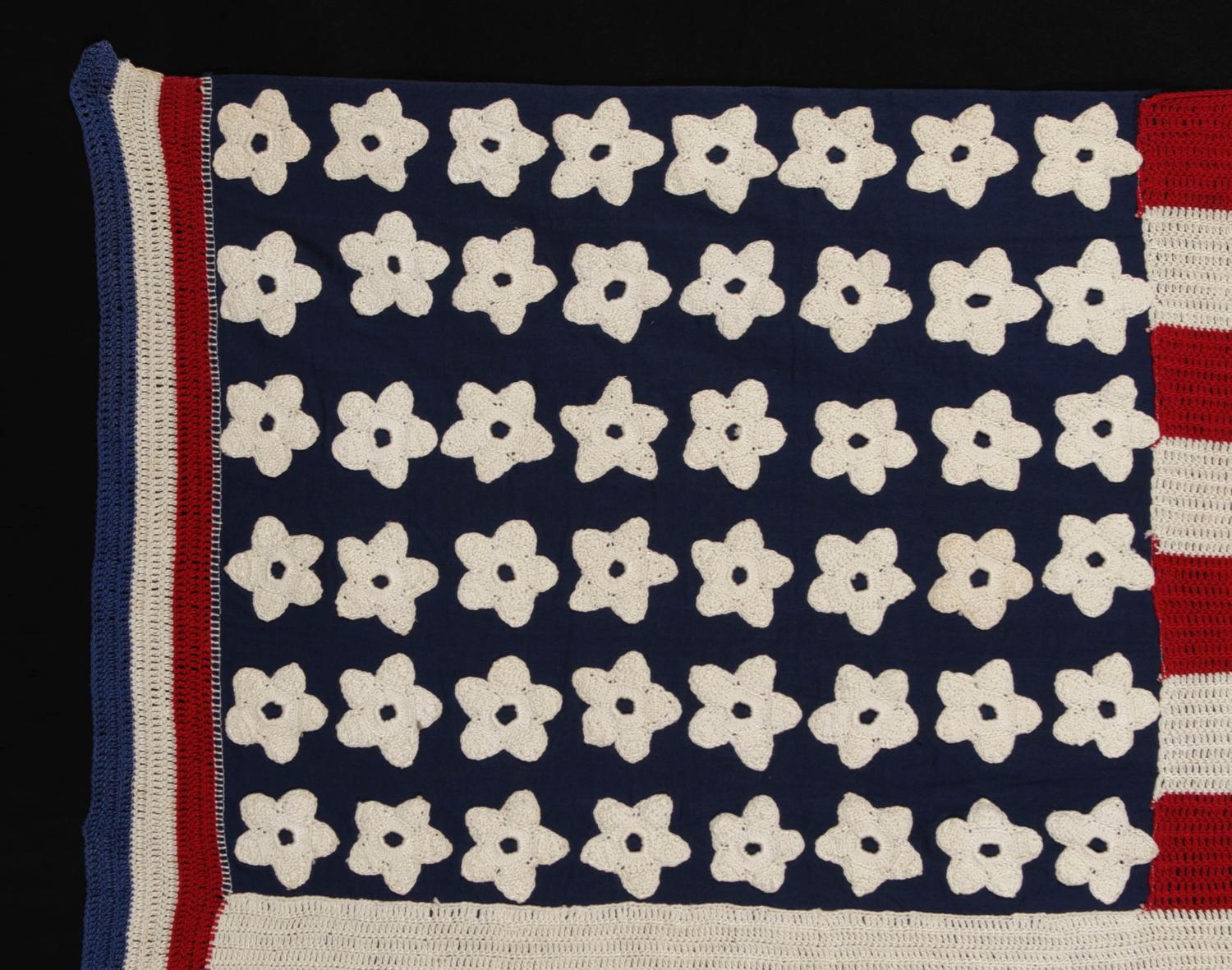 48 star, crocheted, antique american flag of the wwii era (1941-1945), a beautiful, homemade example, with a red, white, & blue hoist and flower-like stars:

Crocheted American flag of the WWII era (U.S. involvement 1941-1945), with some