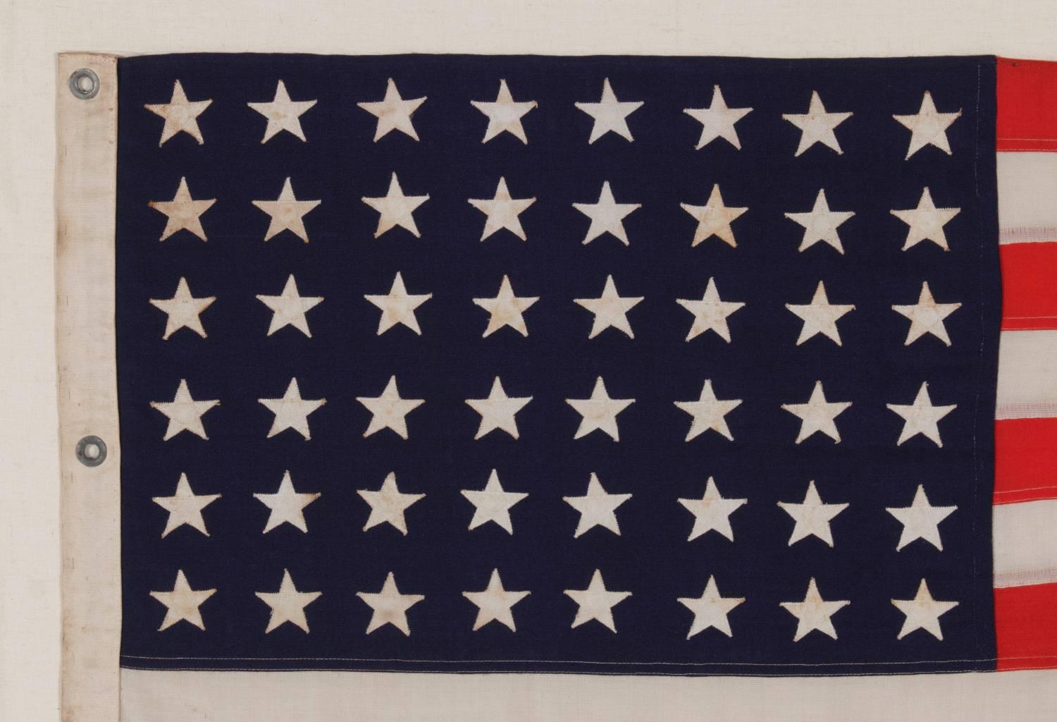 48 STAR FLAG & MATCHING COMMISSIONING PENNANT OF THE WWII ERA, SELDOM EVER FOUND IN A MATCHING PAIR, BROUGHT HOME BY U.S. NAVY AMPHIBIOUS FORCES GROUP SAILOR LUTHER VOIGHT LINGLE, WHO SERVED ON THE U.S.S. REEVES, THE FIRST AMERICAN SHIP TO DROP