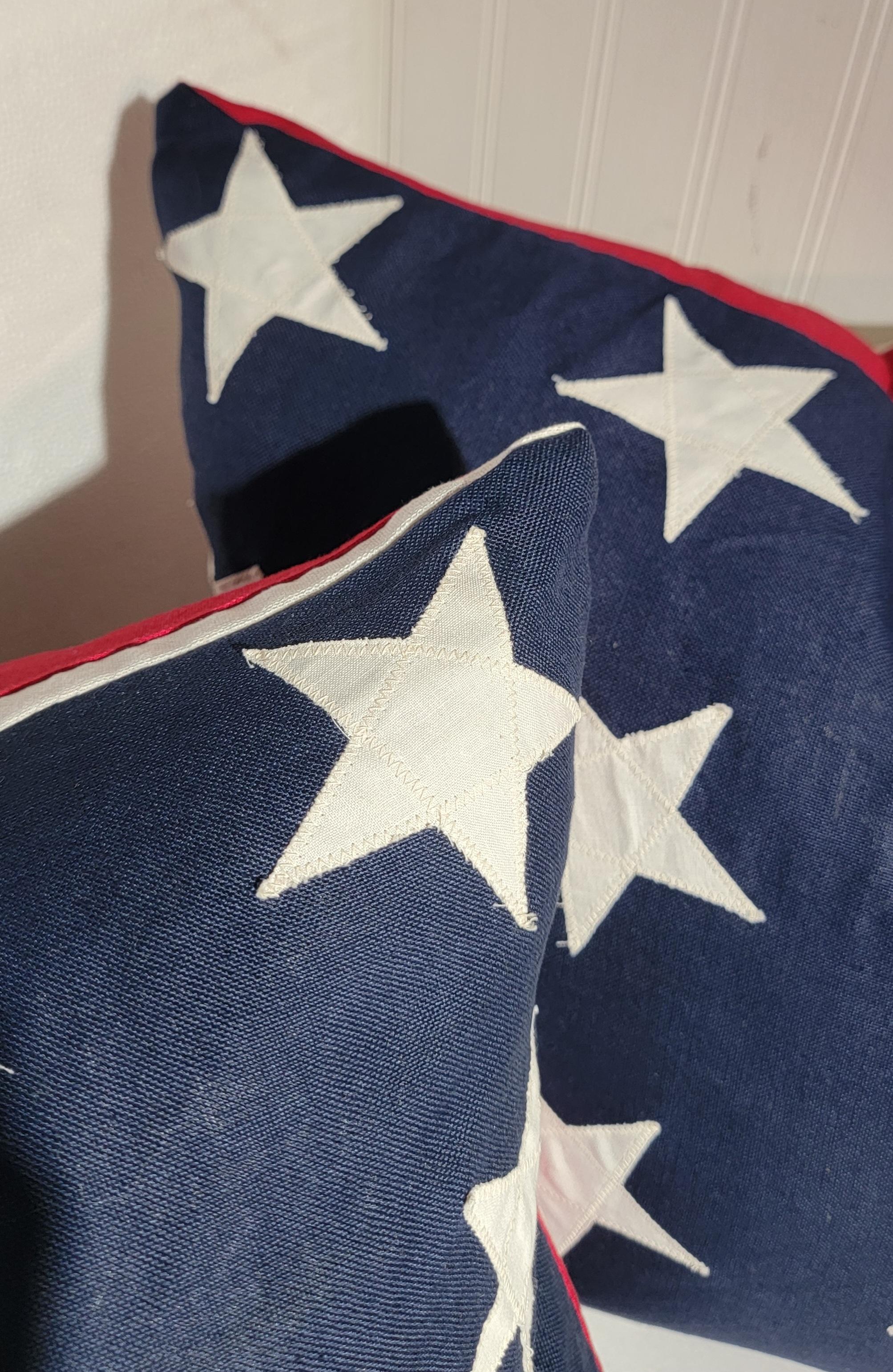 These fun patriotic flag pillows are in wool and made from a 48 star flag.Sold as a pair and down & feather fill.Perfect for your folk art collection or fourth of July picnic. Sold as a pair.