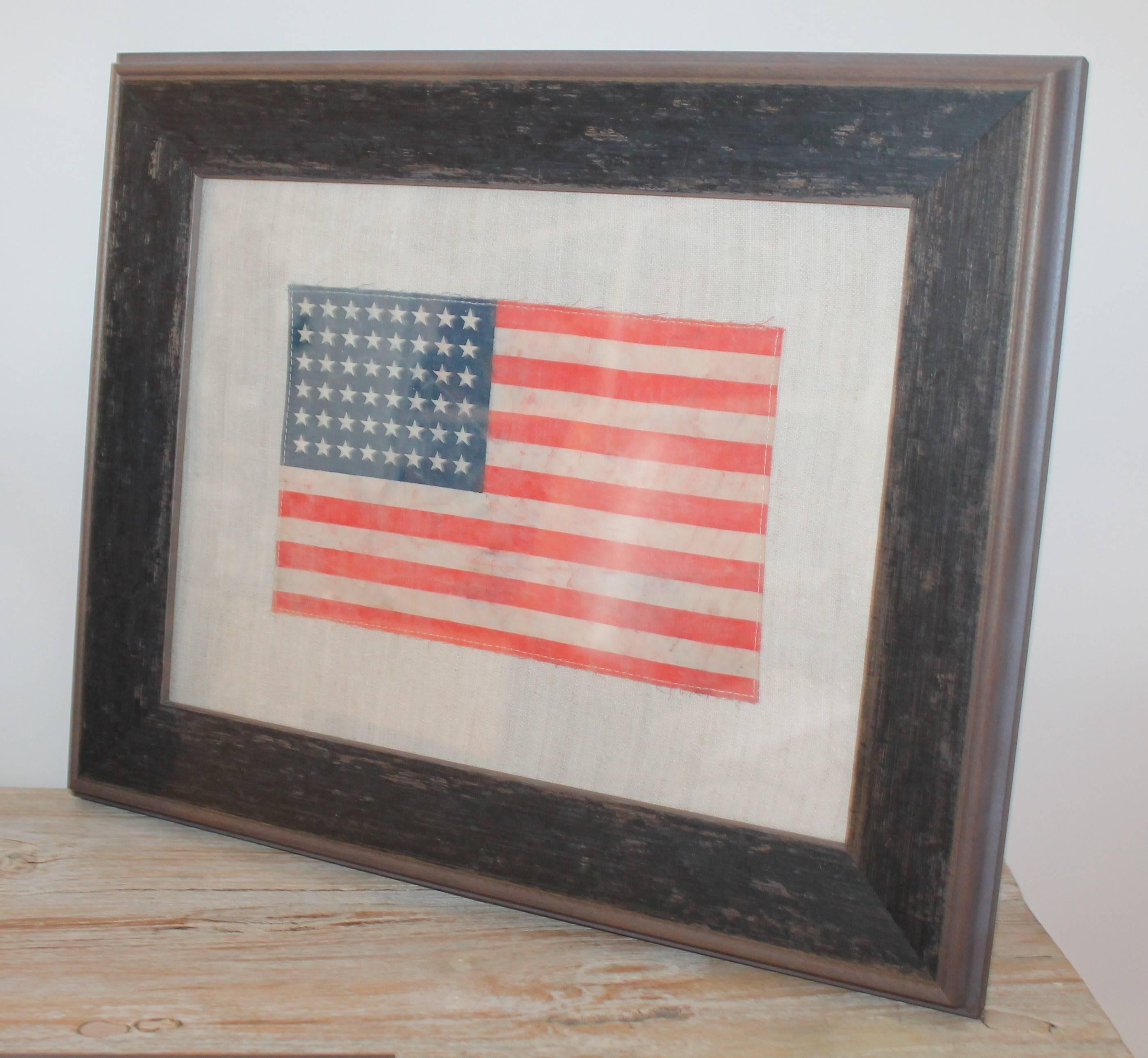 48 star flag is made from a vintage oil cloth sewn on vintage linen. The frame is a custom made frame on each. Each Measures 14 x 17.5.

If anyone would like to purchase all three, we offer all three @ $2,295.
     