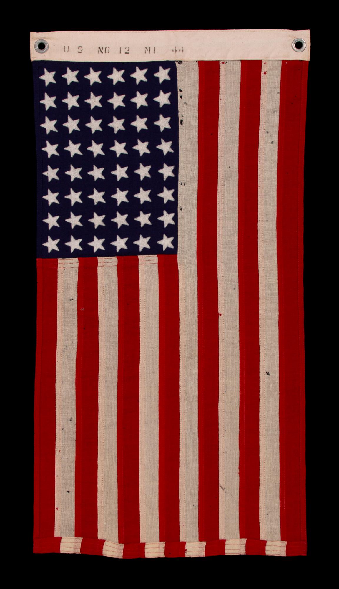 48 STAR, U.S. NAVY SMALL BOAT ENSIGN, MADE AT MARE ISLAND, CALIFORNIA DURING WWII, SIGNED AND DATED 1944, IN THE SMALLEST SCALE EMPLOYED AT THE TIME

48 star American national flag, made during World War II (U.S. involvement 1941-45) at Mare Island,
