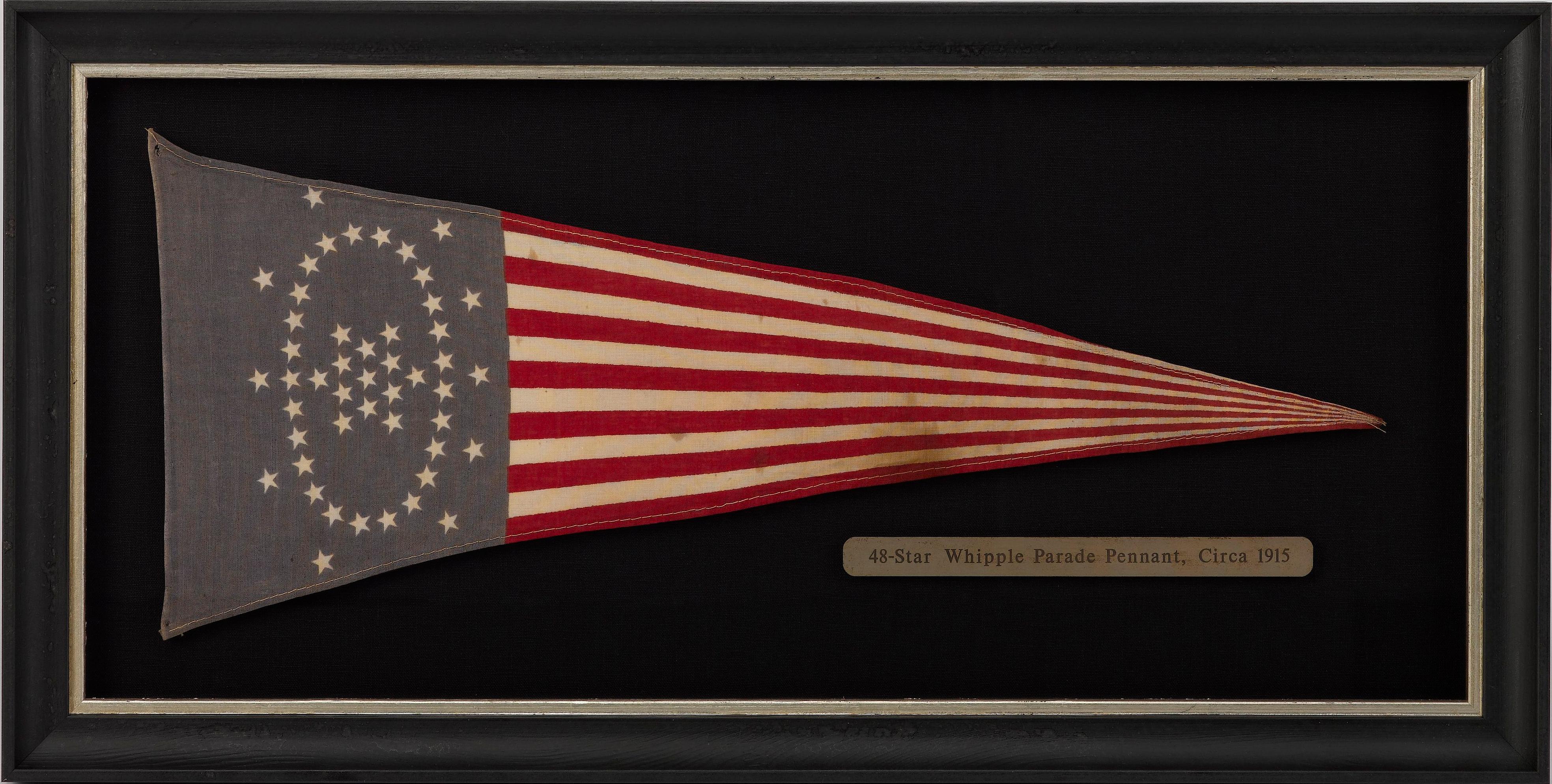 This is a beautiful example of a printed Whipple star flag pennant. In the first decade of the twentieth century, a contest to design a classical style of American heraldry was held. The flag designed by Wayne Whipple, a well-known author of popular
