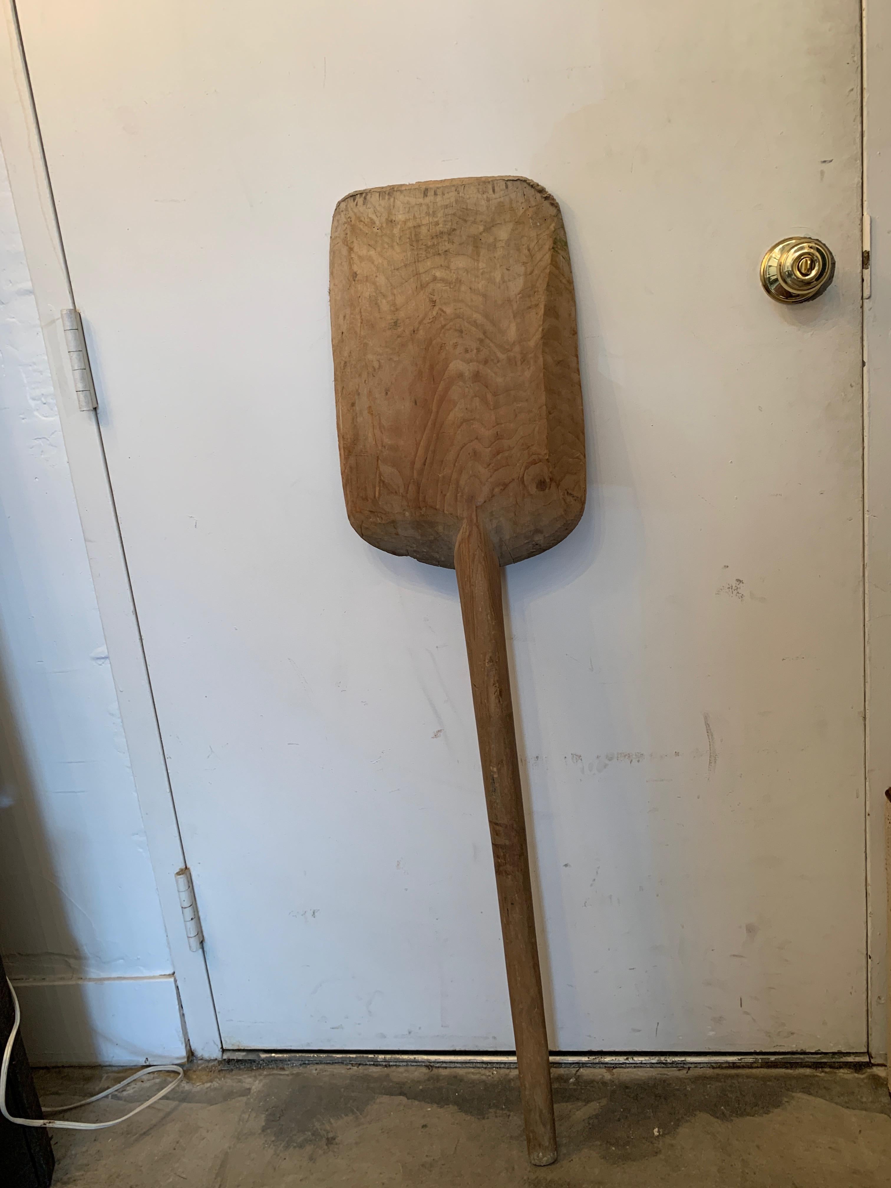 A vintage European baking paddle, shaped like a shovel/spade to allow for large batches of dough, originally designed for guiding soon-to-be loaves of bread into large bread ovens. Also makes for wonderful rustic home decor. Measures: 48