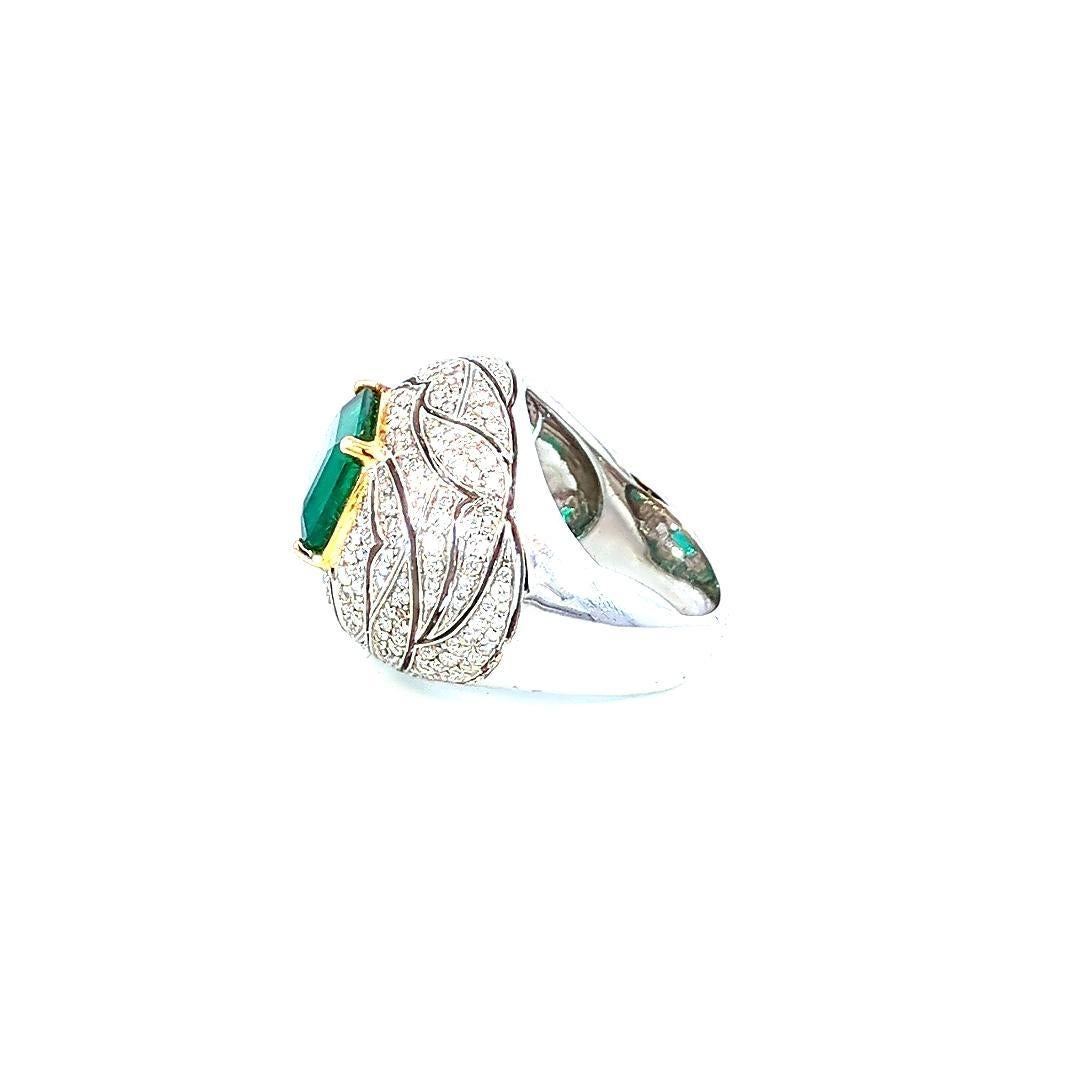 Introducing our exquisite Emerald and Diamond Ring, a captivating masterpiece that beautifully marries the brilliance of diamonds with the lush green allure of emeralds. This ring, expertly crafted in 18K gold, is a symbol of opulence and