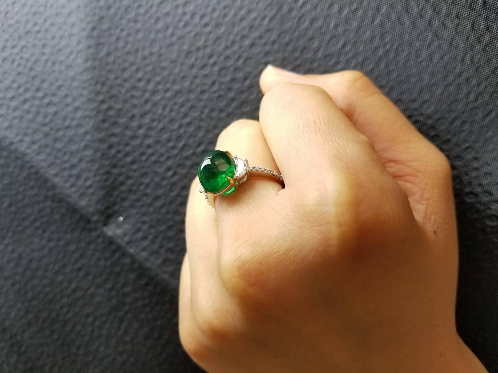 Oval Cut 4.80 Carat Emerald Cabochon and Diamond Three-Stone Ring