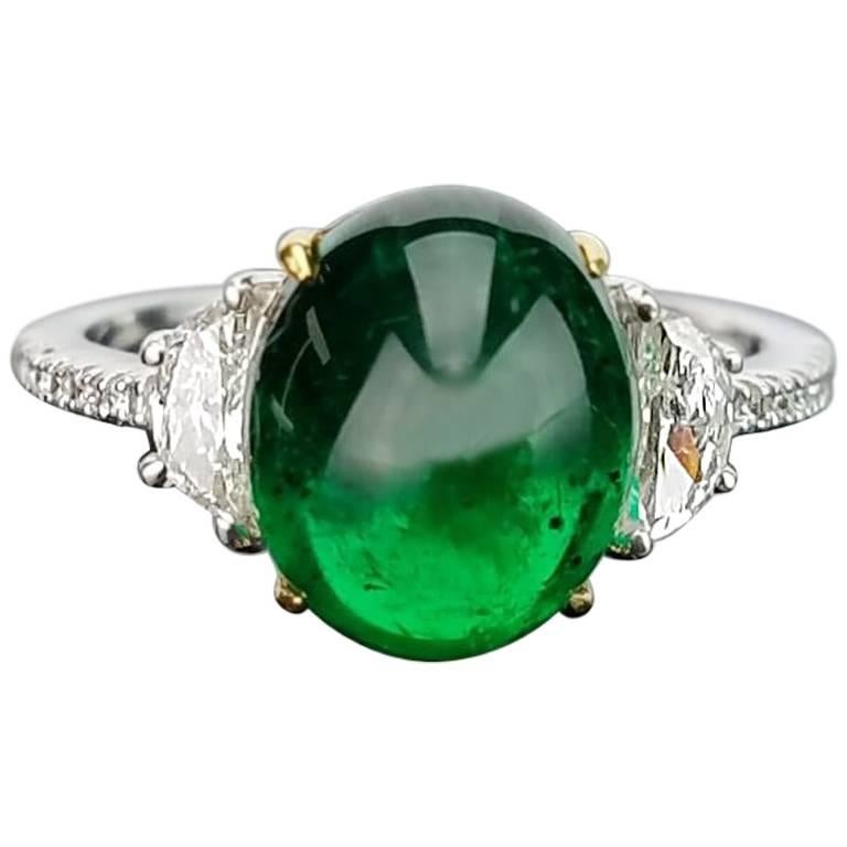 4.80 Carat Emerald Cabochon and Diamond Three-Stone Ring