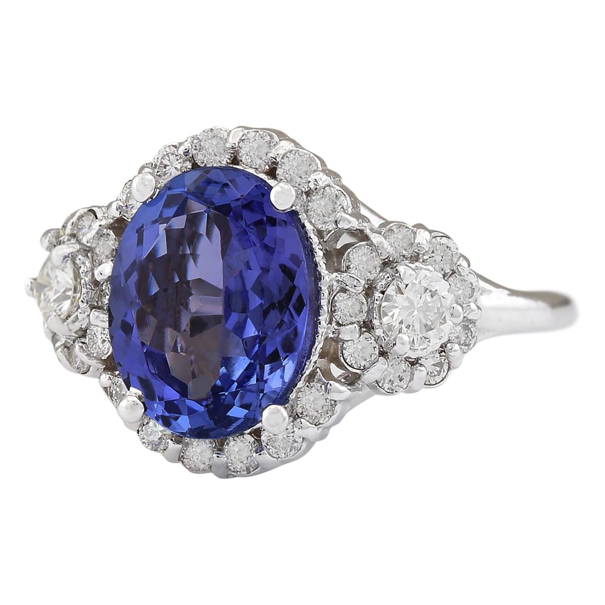 Stamped: 14K White Gold
Total Ring Weight: 5.5 Grams
Total Natural Tanzanite Weight is 3.90 Carat (Measures: 11.00x9.00 mm)
Color: Blue
Total Natural Diamond Weight is 0.90 Carat
Color: F-G, Clarity: VS2-SI1
Face Measures: 17.30x13.30 mm
Sku: