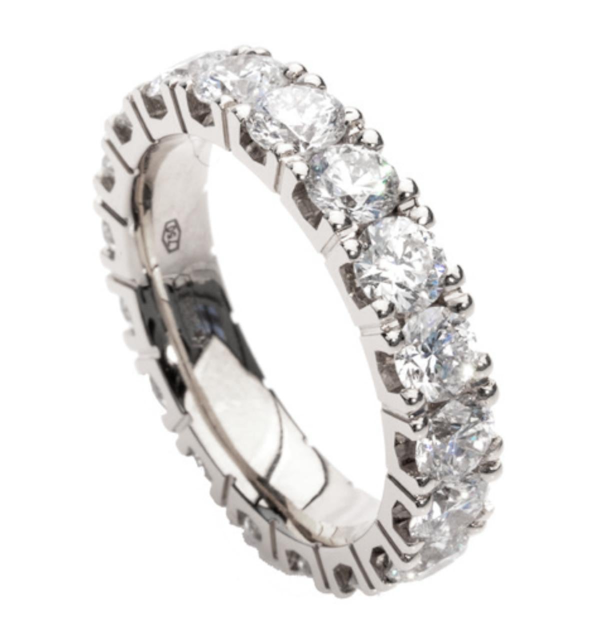 Immerse yourself in supreme elegance with our captivating Modern Eternity Band Ring, adorned with 4.80 carats of brilliant-cut diamonds and masterfully crafted in exquisite 18-carat white gold. This extraordinary piece is a harmony of modernity,
