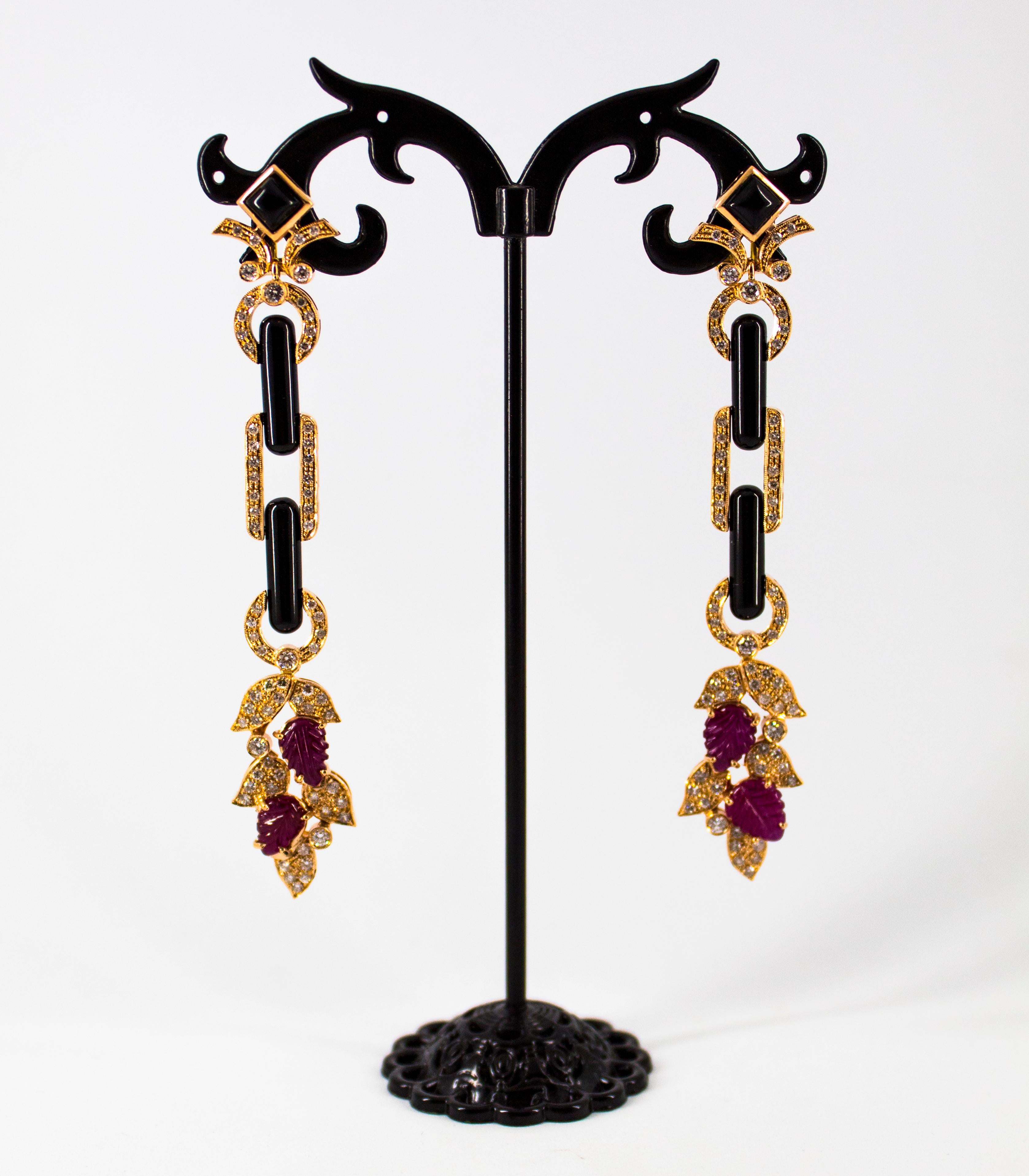 These Earrings are made of 14K Yellow Gold.
These Earrings have 1.76 Carats of White Diamonds.
These Earrings have 4.80 Carats of Rubies.
These Earrings have also Onyx.
All our Earrings have pins for pierced ears but we can change the closure and