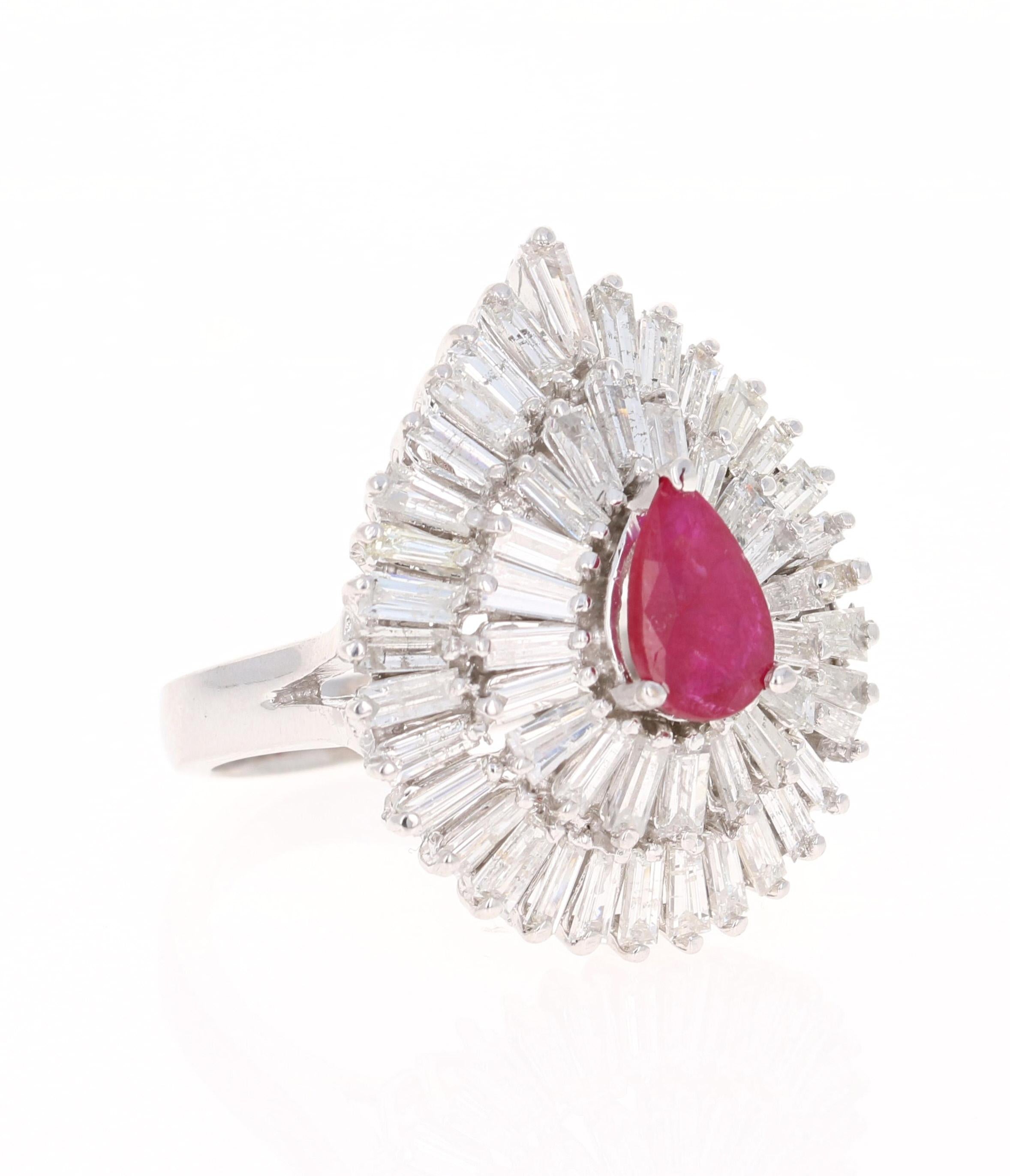 This ring is truly a remarkable piece that will surely add value to ones collection of jewels! A ballerina ring at its best! 

There is a Pear Cut Ruby set in the center of the ring that weighs 1.10 carats. There are 53 Baguette Cut Diamonds that