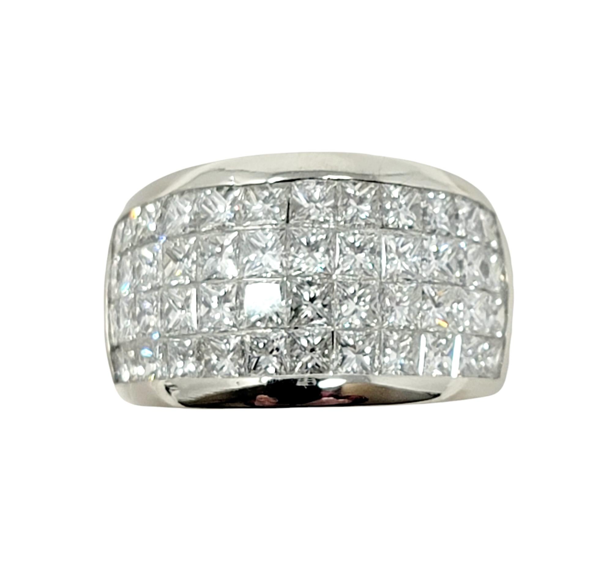 Ring size: 5

This stunning diamond cocktail ring wraps elegantly around the finger and fills it with sparkle from end to end. Featuring a contemporary wide band design, this ring is smooth, sleek, and sophisticated. The closely set natural stones