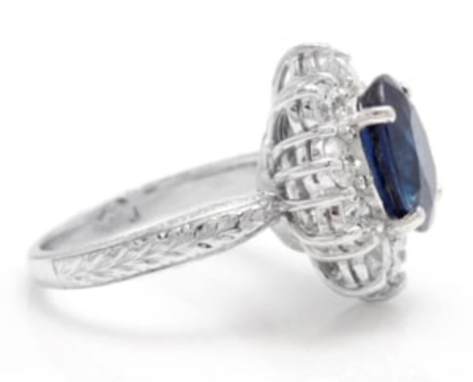 4.80 Carats Exquisite Natural Blue Sapphire and Diamond 14K Solid White Gold Ring

Total Blue Sapphire Weight is: Approx. 3.00 Carats

Sapphire Measures: 9.00 x 7.00mm

Natural Round Diamonds Weight: Approx. 1.80 Carats (color G-H / Clarity
