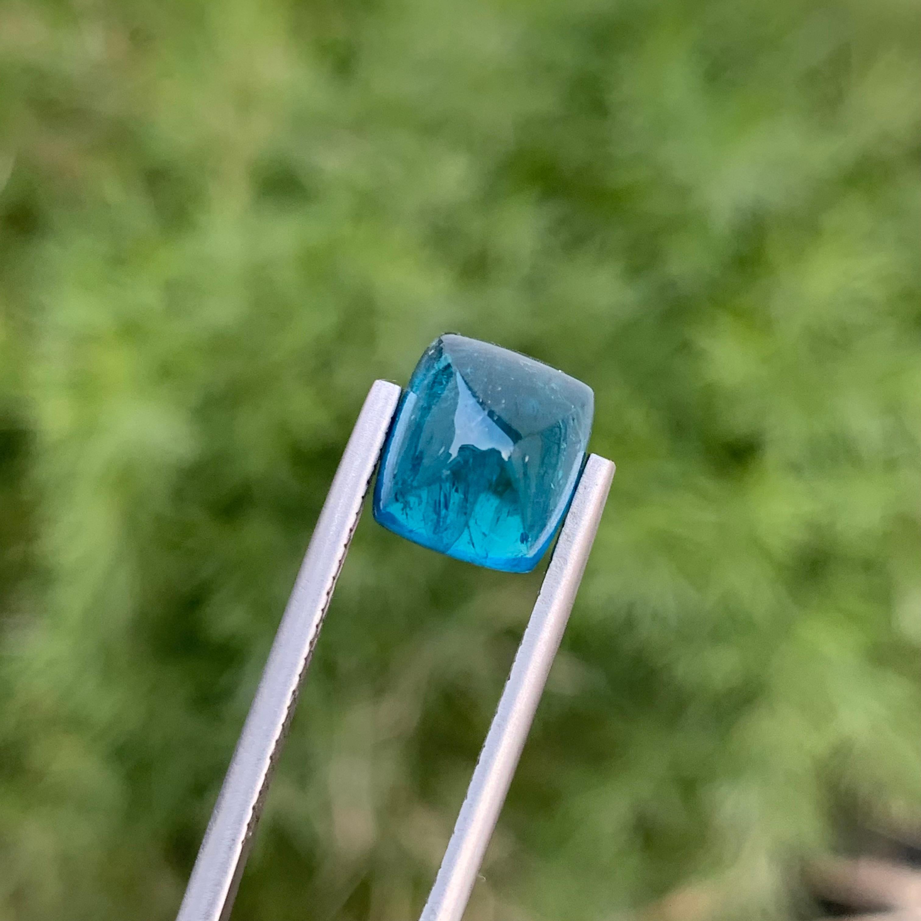 Indicolite Tourmaline 
Weight: 4.80 Carats 
Dimension: 9.7x8.2x7.6 Mm
Origin: Kunar Afghanistan 
Shape: Sugarloaf
Treatment: Non
Color: Blue
Indicolite, a mesmerizing variety of tourmaline, captivates with its stunning blue hues. Ranging from