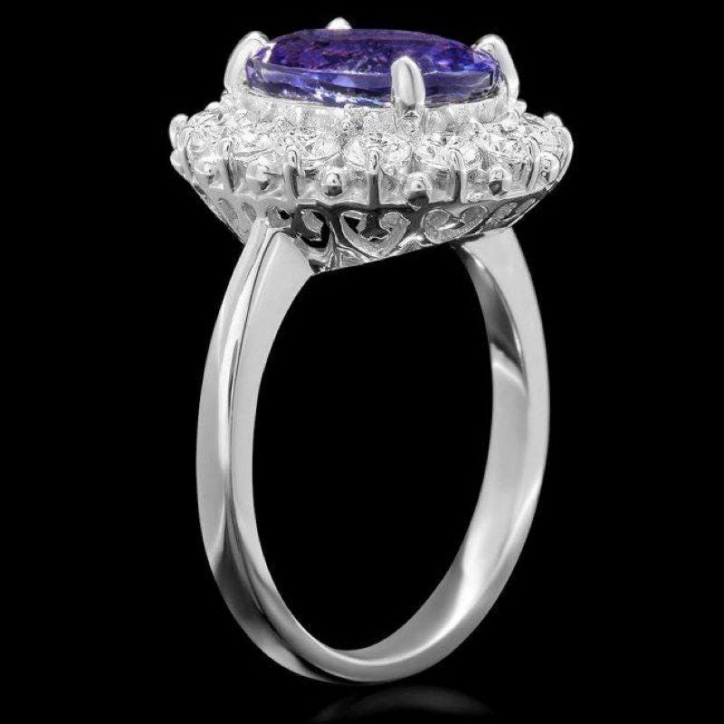 4.80 Carats Natural Tanzanite and Diamond 14K Solid White Gold Ring

Total Natural Tanzanite Weight is: Approx. 3.90 Carats 

Tanzanite Measures: Approx. 11.00 x 8.00mm

Natural Round Diamonds Weight: Approx. 0.90 Carats (color G-H / Clarity