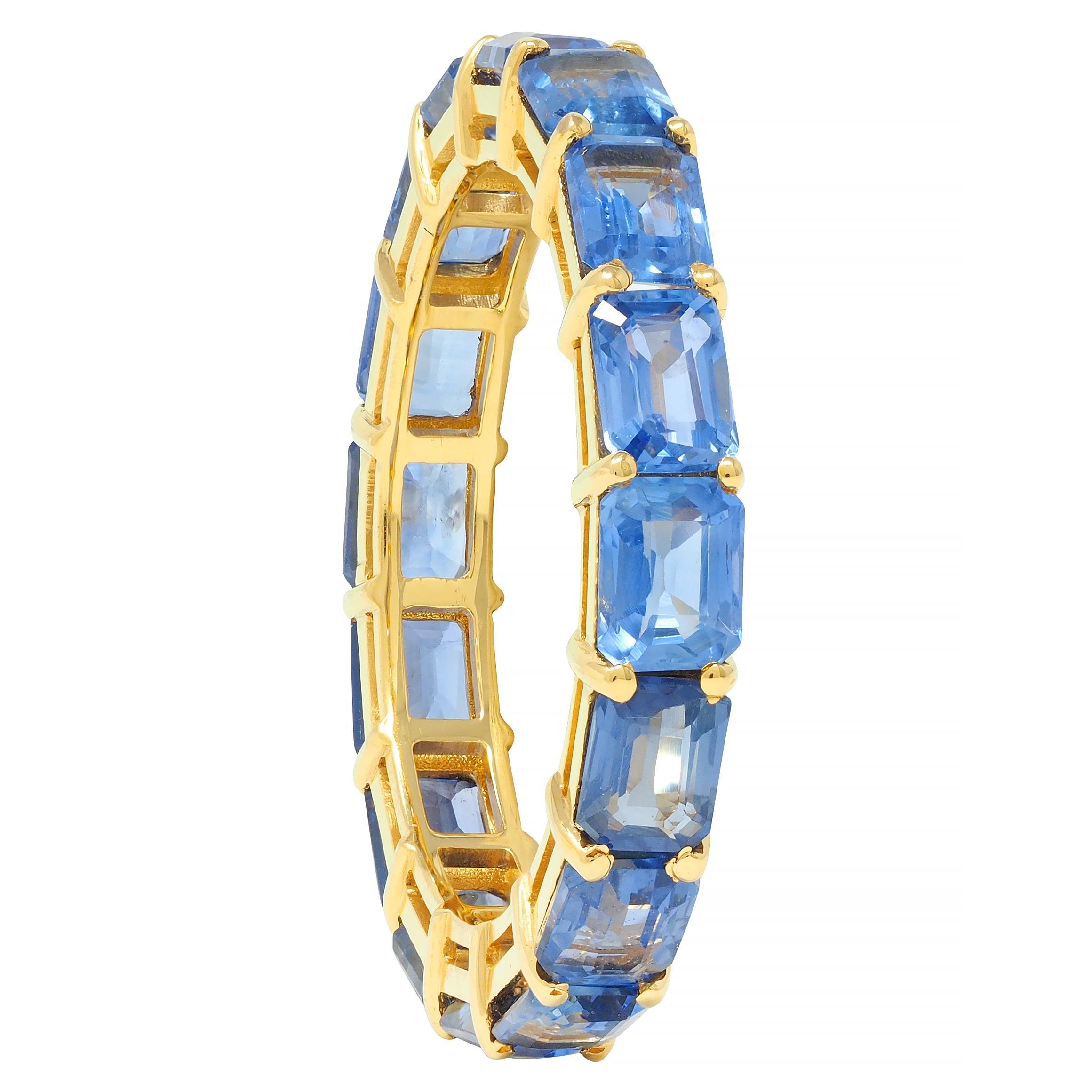 Comprised of emerald cut sapphires prong set East to West in wire baskets fully around
Weighing approximately 4.80 carats total
Transparent light to medium blue in color
Completed by high polished gold finish
Tested as 18 karat gold
Circa;