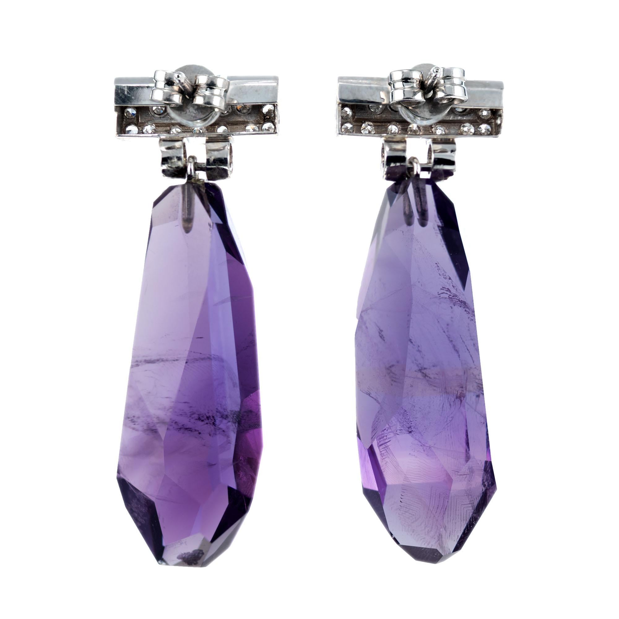 Natural 48.00 carat amethyst crystal dangle drop earrings. Set in platinum with 40 single cut accent diamonds. , approx. total weight 48.00cts. 

2 natural polished bright purple Amethyst crystals, approx. total weight 48.00cts, SI2 - I2, natural