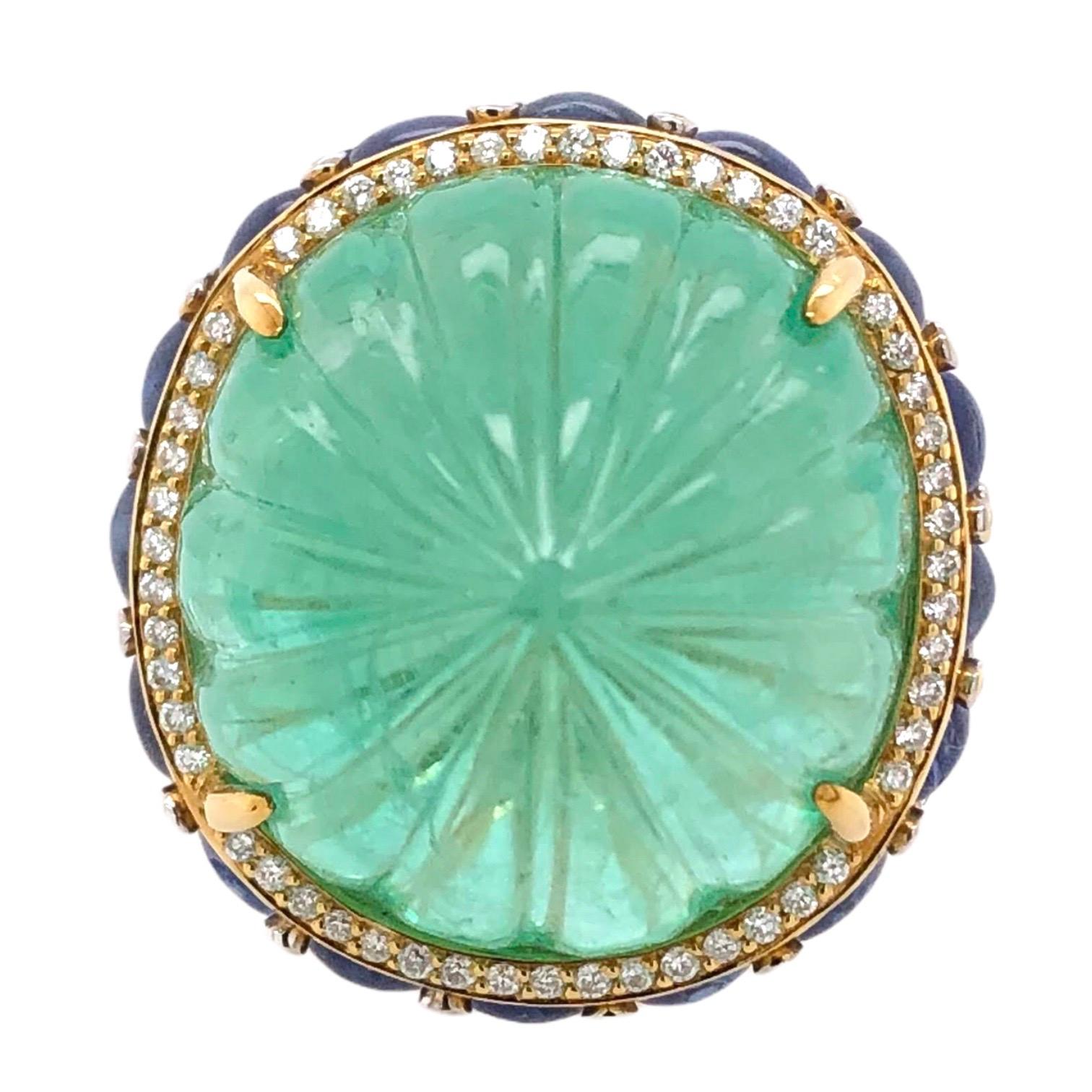 48.00ct GRS Certified Colombia Emerald Ring with Cabochon Sapphires and Diamonds.

- 1 GRS Certfieid Colombia Emerald/48.00ct
- Cabochon Light Blue Sapphires
- Round Diamonds
- 18K Yellow Gold
- Size of ring fitted to finger.

Designed and crafted