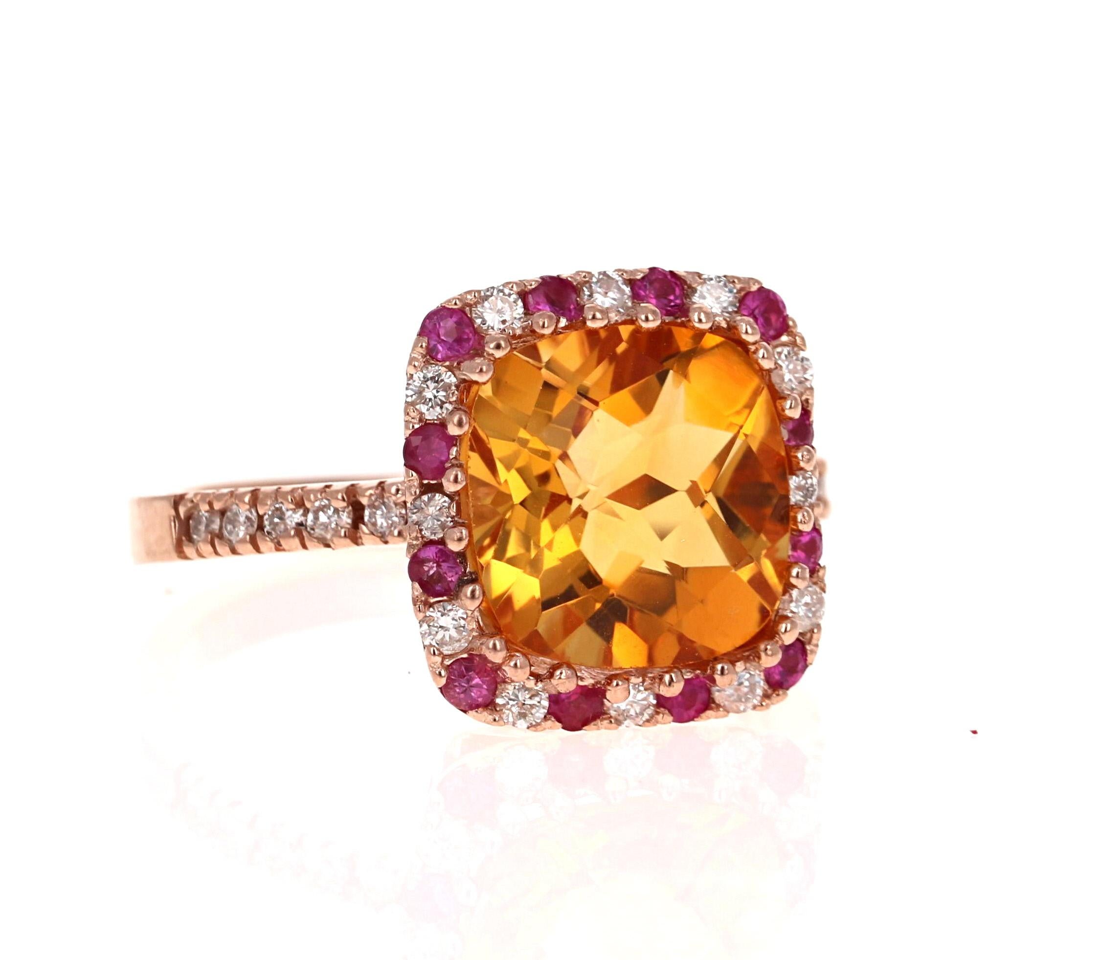 A Stunning and Unique piece to say the least! 

This magnificent ring has a bold Cushion Cut Citrine that is blazing yellow! It weighs 4.09 carats and is surrounded by a beautiful row of alternating Diamonds and Pink Sapphires. There are 12 Round
