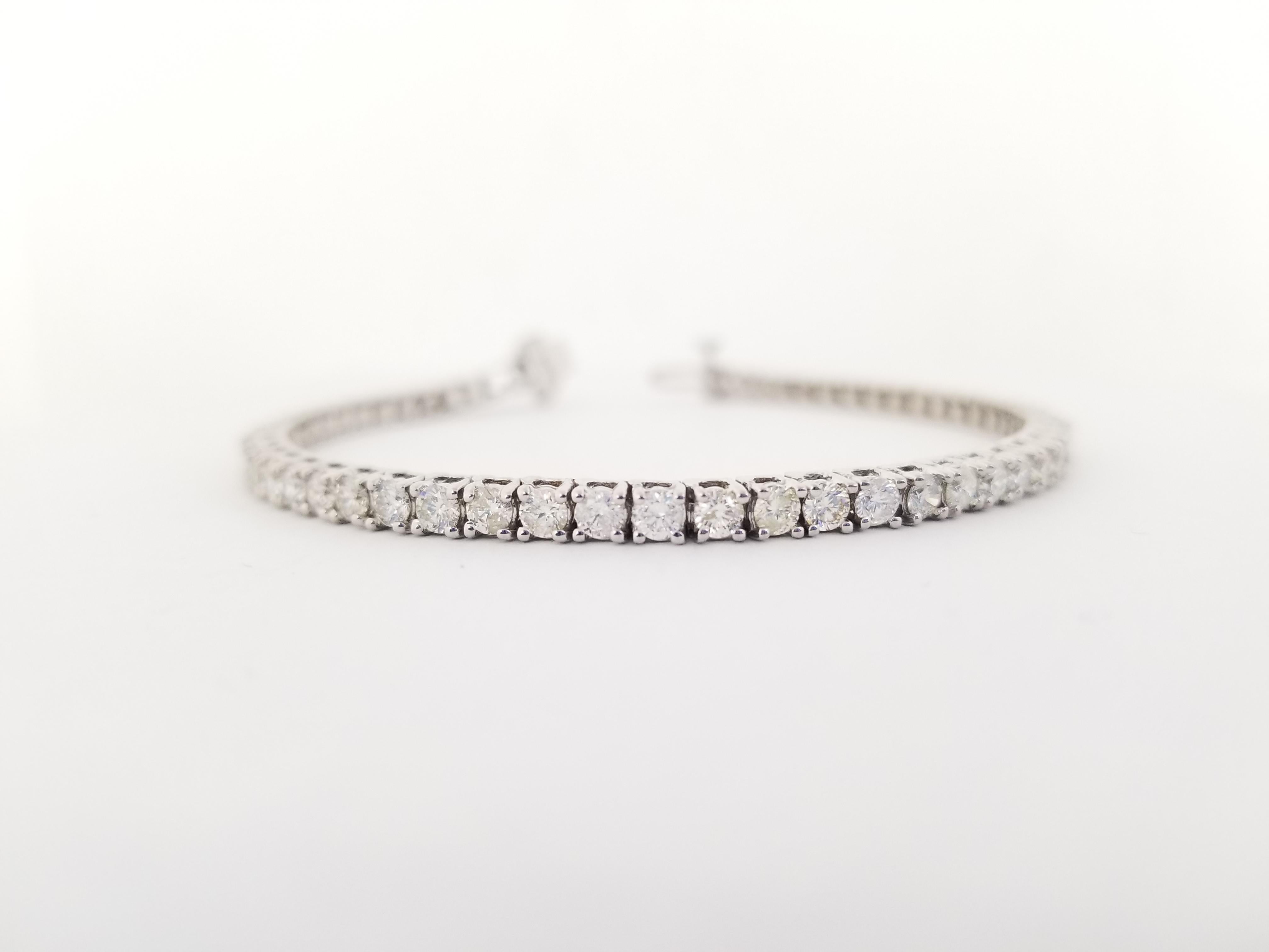 Brilliant and beautiful, set on 14K white gold. each stone is set in a classic four-prong style for maximum light brilliance. Bright and Shiny, Bold and Beautiful.

14 Karat White Gold
Natural Diamond 4.80 cwt.
Average Color I, Clarity SI 
7 inch