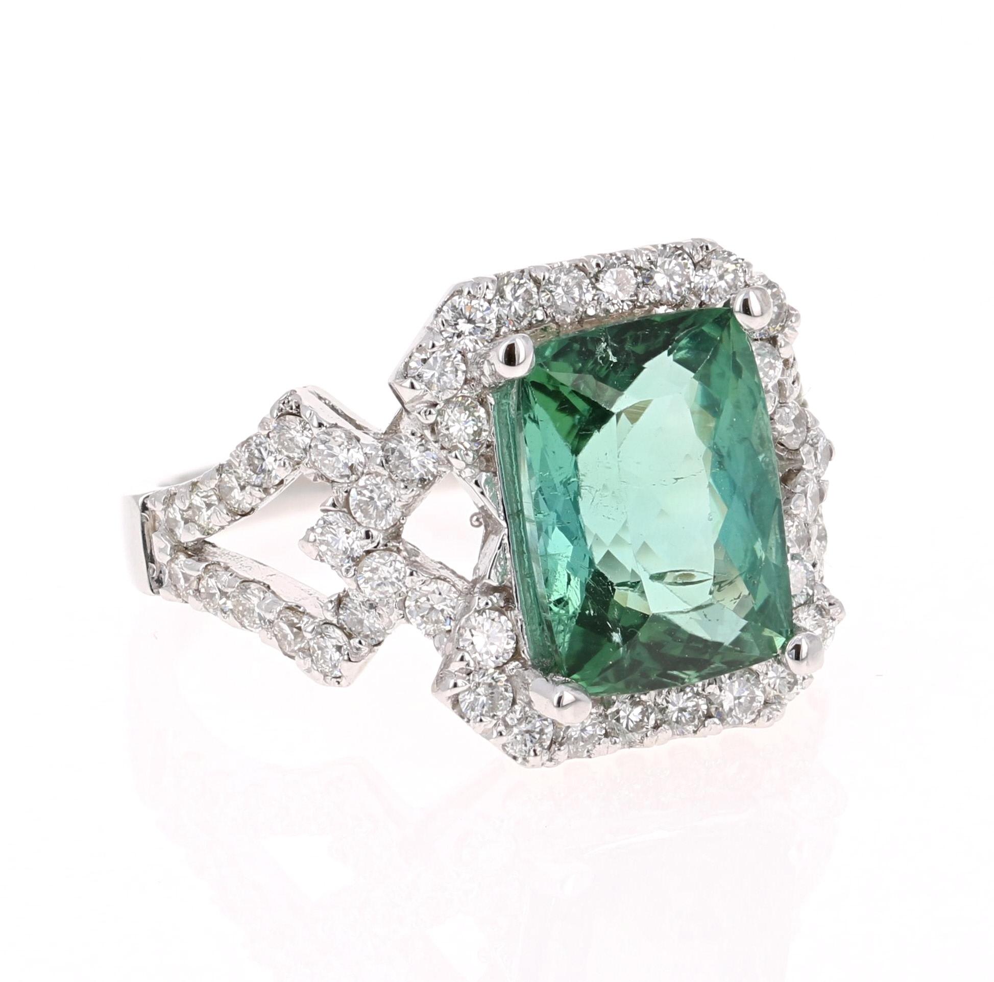 Gorgeous & Unique Cocktail Ring!

This ring has a STUNNING Emerald Cut Green Tourmaline that weighs 3.83 Carats. Floating around the tourmaline are 62 Round Cut Diamonds that weigh 0.98 Carats. The total carat weight of the ring is 4.81 Carats. The