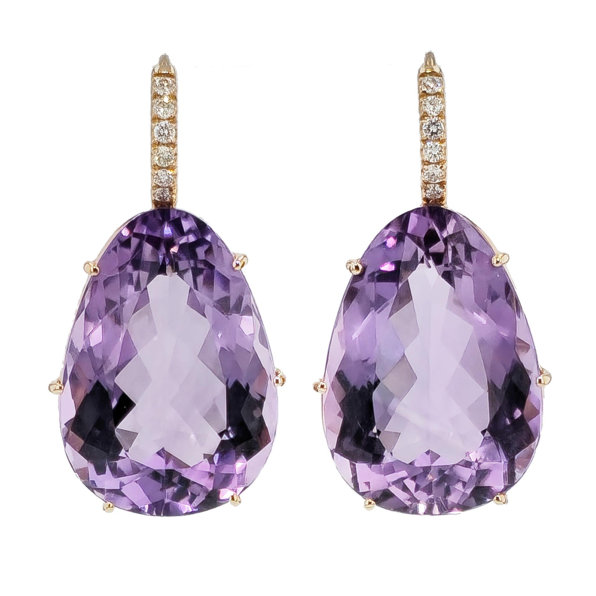 Introducing our exquisite amethyst and diamond pave drop earrings. These are a true treasure from our exclusive handmade collection. 

Crafted with passion, these earrings boast 48.15 carat high quality amethyst drops that radiate with enchanting