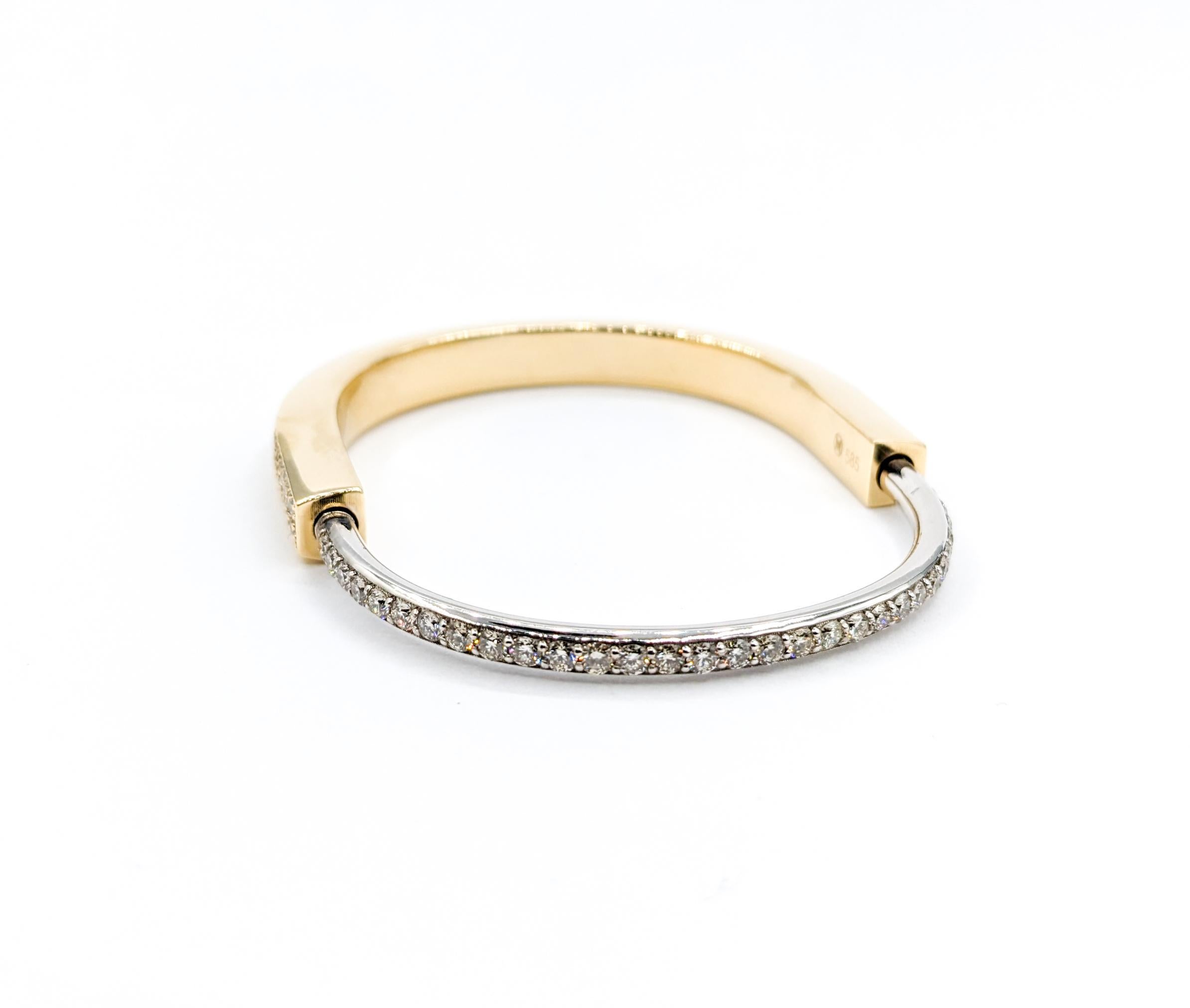 4.81ctw Diamond Lock Shape Two-Tone Bangle Bracelet

Unlock a world of elegance with our stunning two-tone Bracelet, inspired by the timeless symbolism of a lock. Meticulously crafted in 14k Two-Tone Gold, this beautiful piece features a