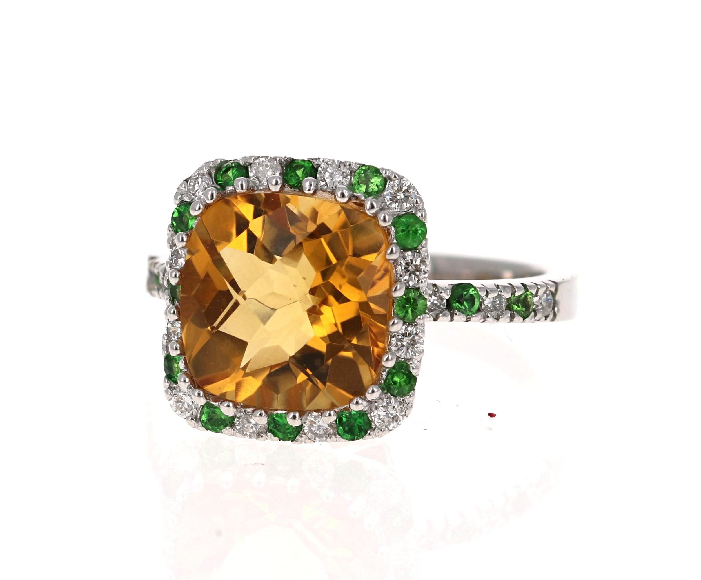Beautiful to say the Least! This magnificent Cushion Cut Citrine Quartz weighs 4.23 Carats and is surrounded by alternating Round Cut Diamonds that weigh 0.28 Carats (Clarity: SI, Color: F) and Round Cut Tsavorites that weigh 0.31 Carats. The total