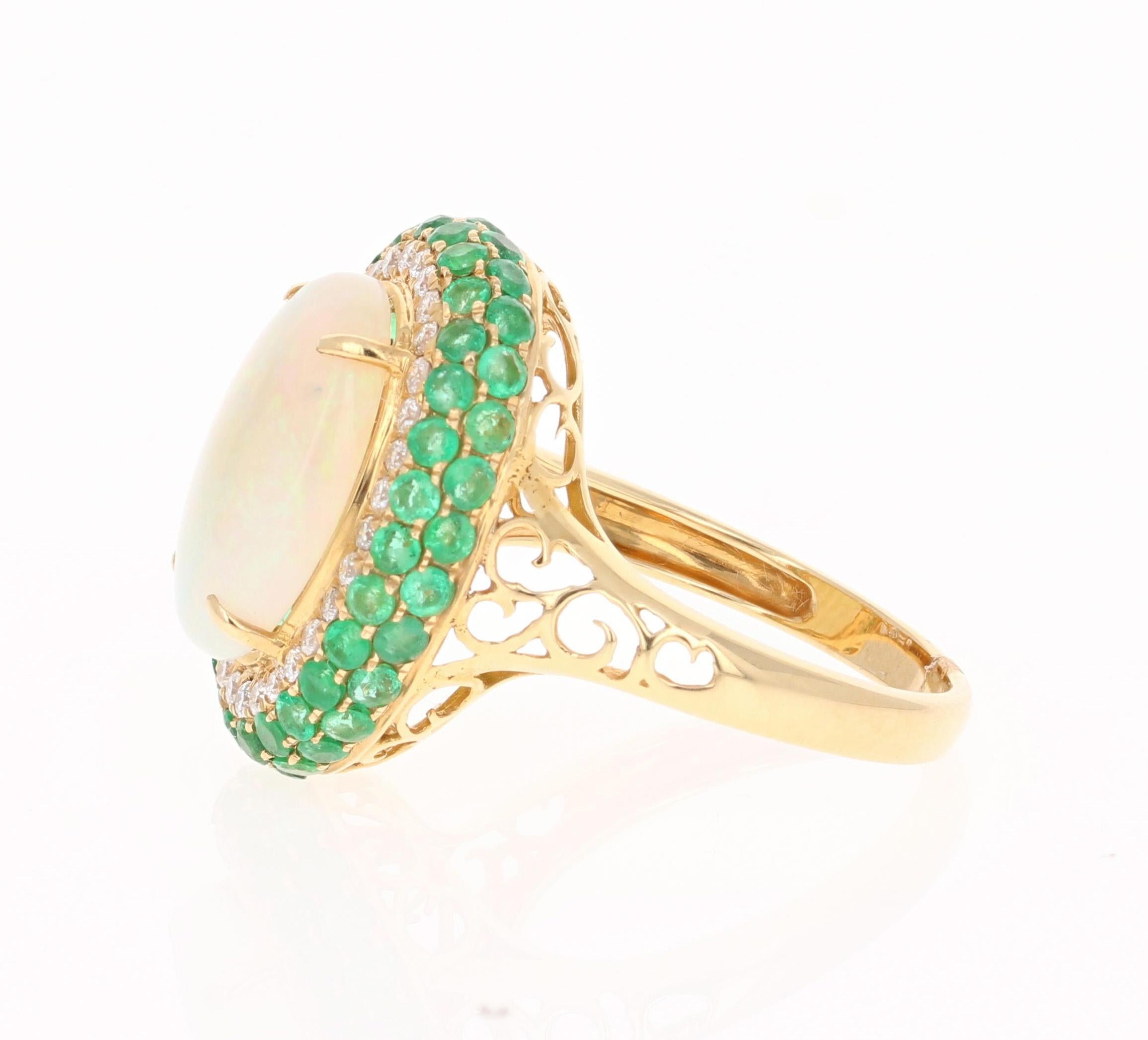 Contemporary 4.82 Carat Opal, Emerald and Diamond 18 Karat Yellow Gold Ring For Sale