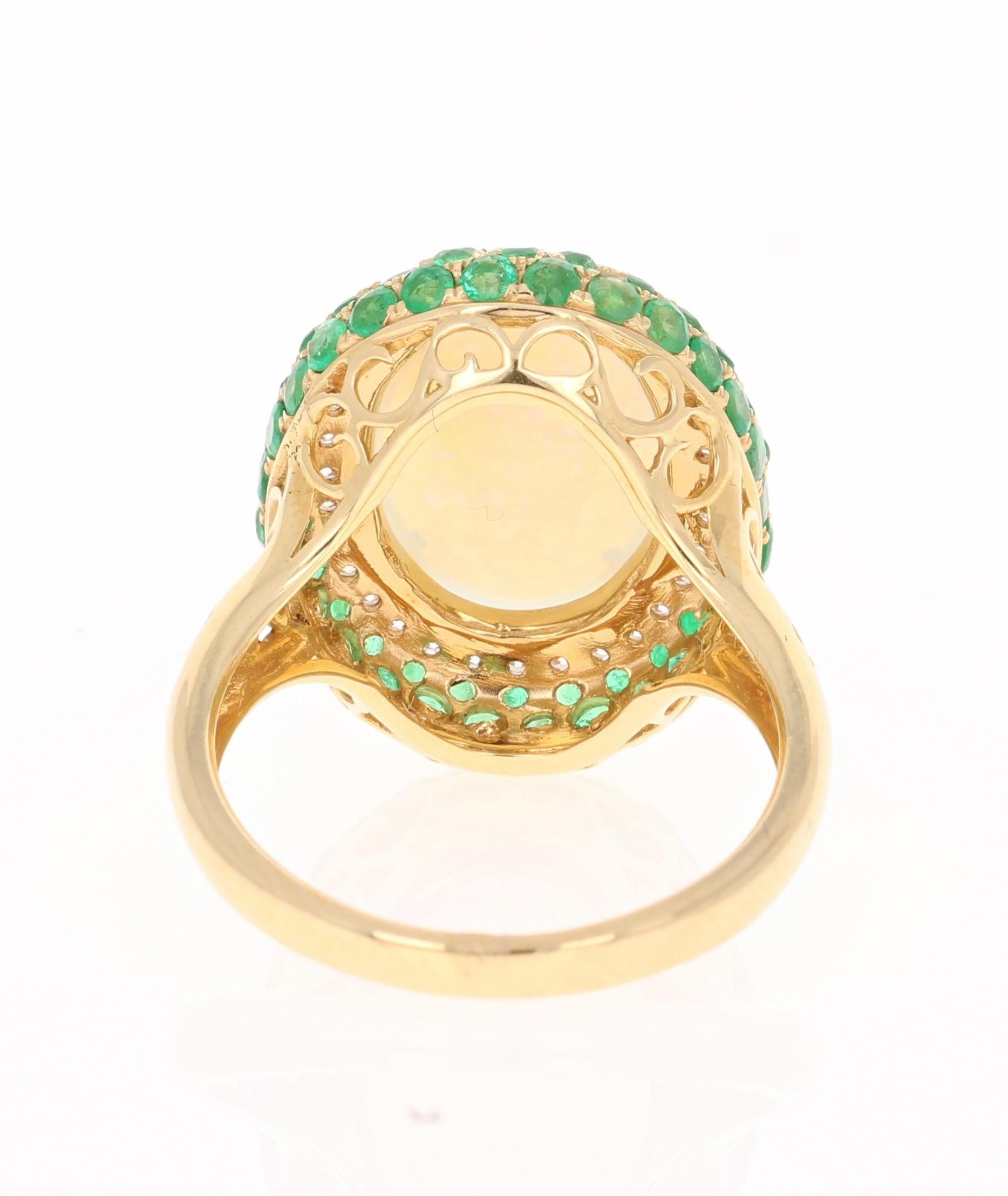 Oval Cut 4.82 Carat Opal, Emerald and Diamond 18 Karat Yellow Gold Ring For Sale