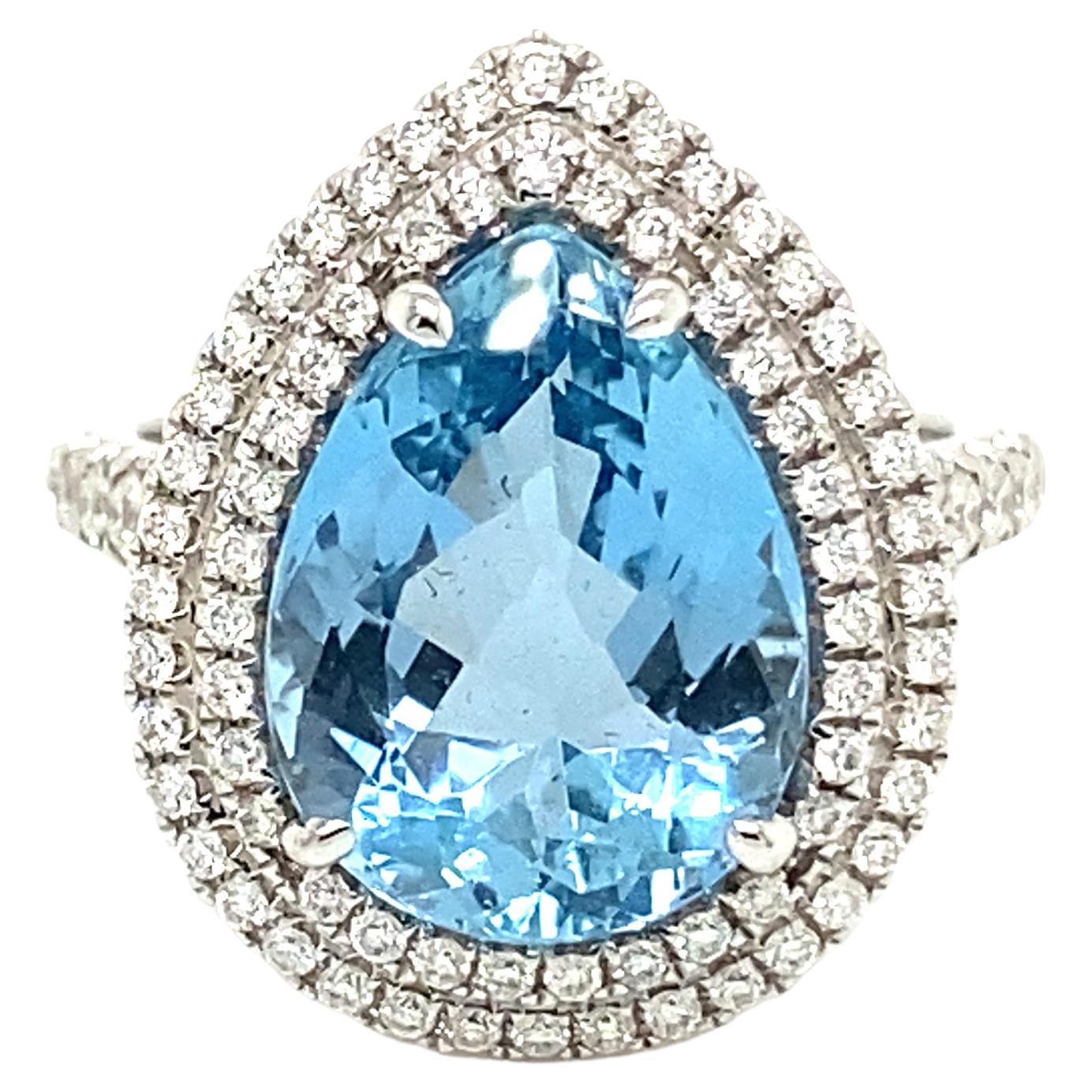 This stunning cocktail ring showcases a beautiful 4.82 Carat Pear Shape Aquamarine with a Double Diamond Halo on a Diamond Shank. 
This ring is set in 18k white gold.
Total Diamond Weight = 0.65 Carats. Ring Size is 6 1/2.