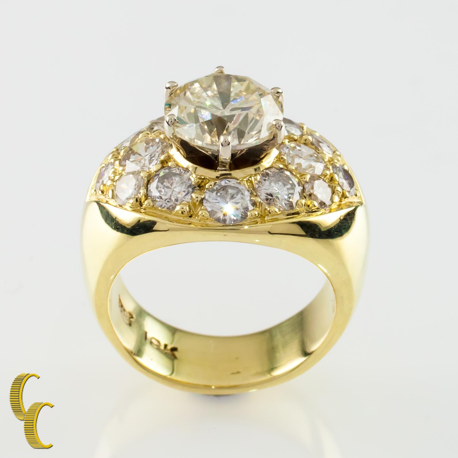 Gorgeous 18k Yellow Gold Diamond Solitaire Ring with Pave Diamond Accent Stones
Gorgeous Round Solitaire Diamond
Weight of Solitaire Diamond = 2.32 ct
Color = L
Clarity = SI2
Almond-Shaped Plaque Set with 14 Various Sized Round Pave-Set